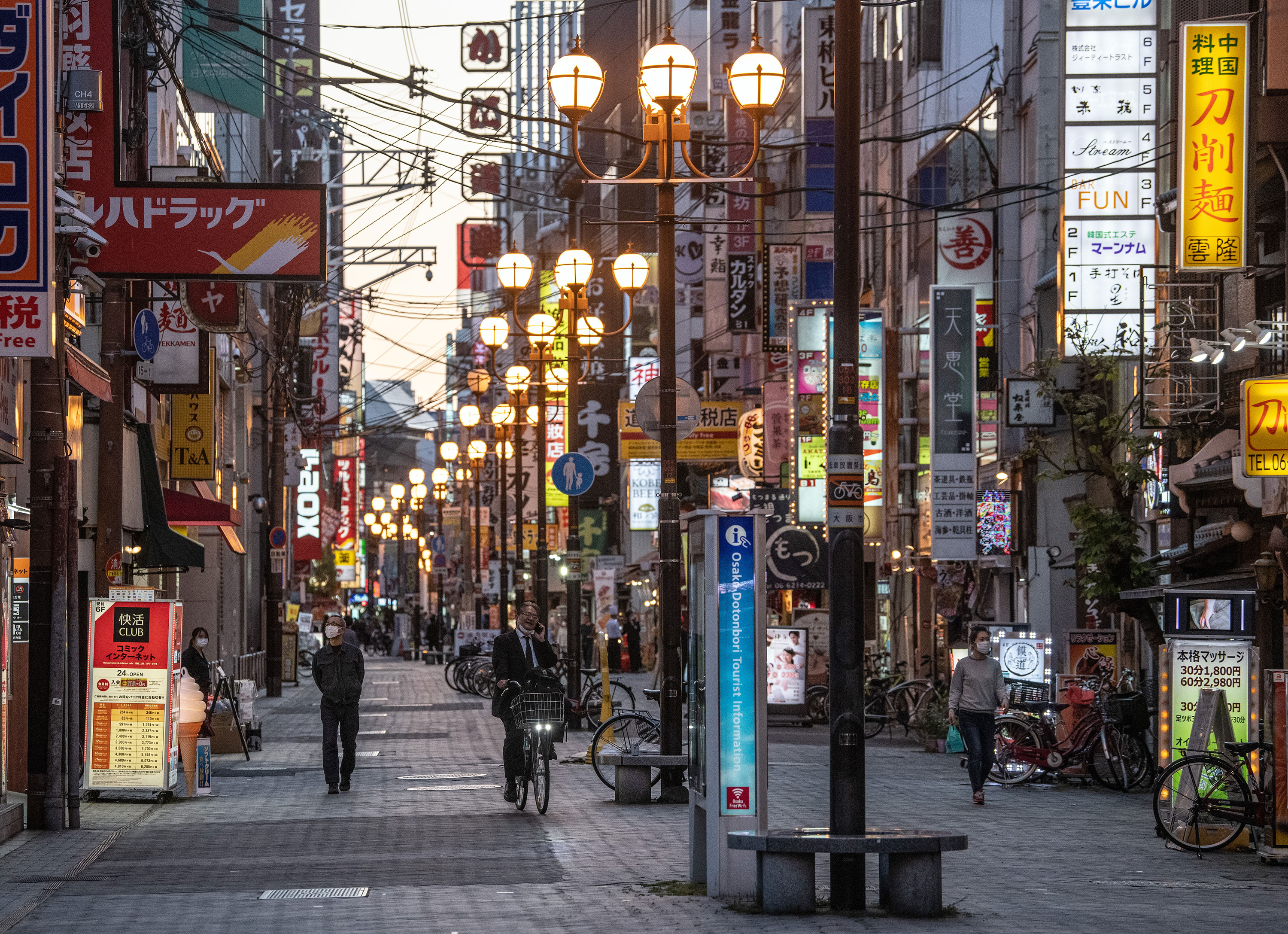 People walk around Dotonbori, one of Osaka's most popular tourist areas, on May 13 in Osaka, Japan.