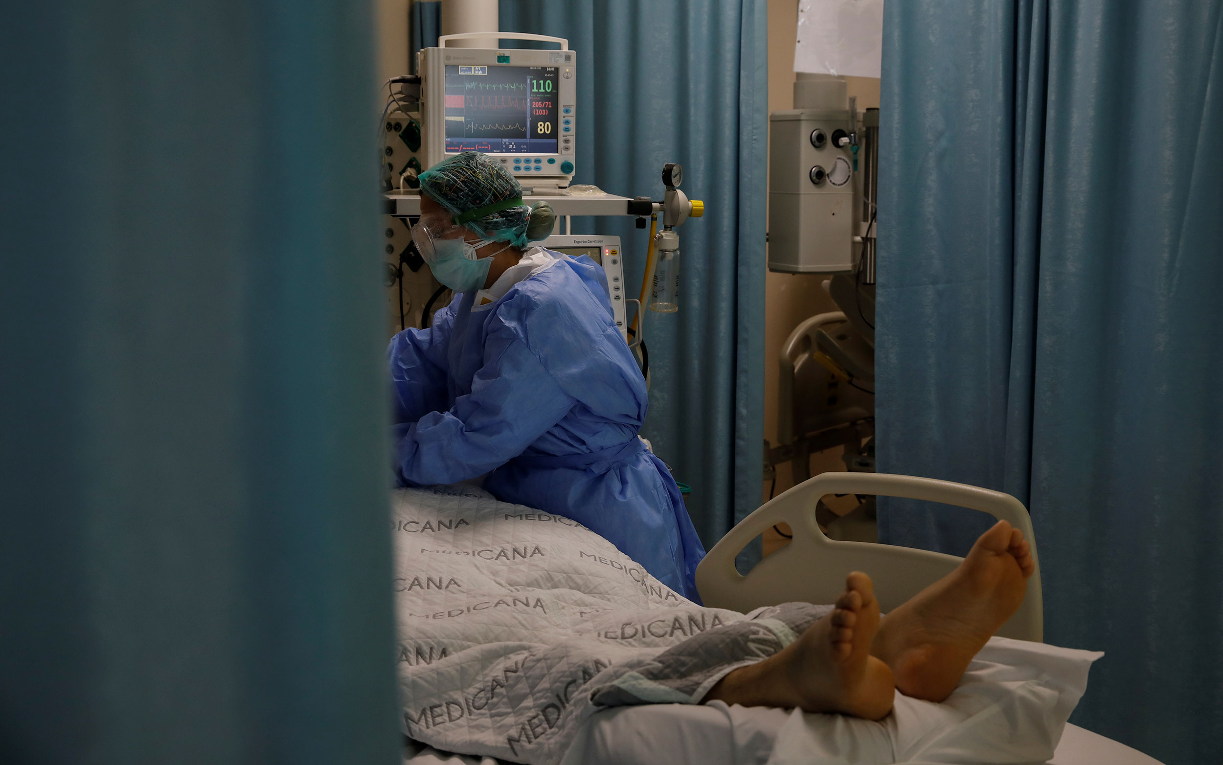 A nurse cares for a coronavirus patient at the Medicana International Hospital in Istanbul, Turkey, on April 14.