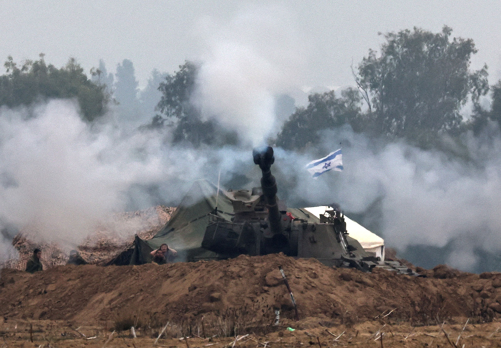 An Israeli artillery unit operates at the border with Gaza on Tuesday, December 5. 