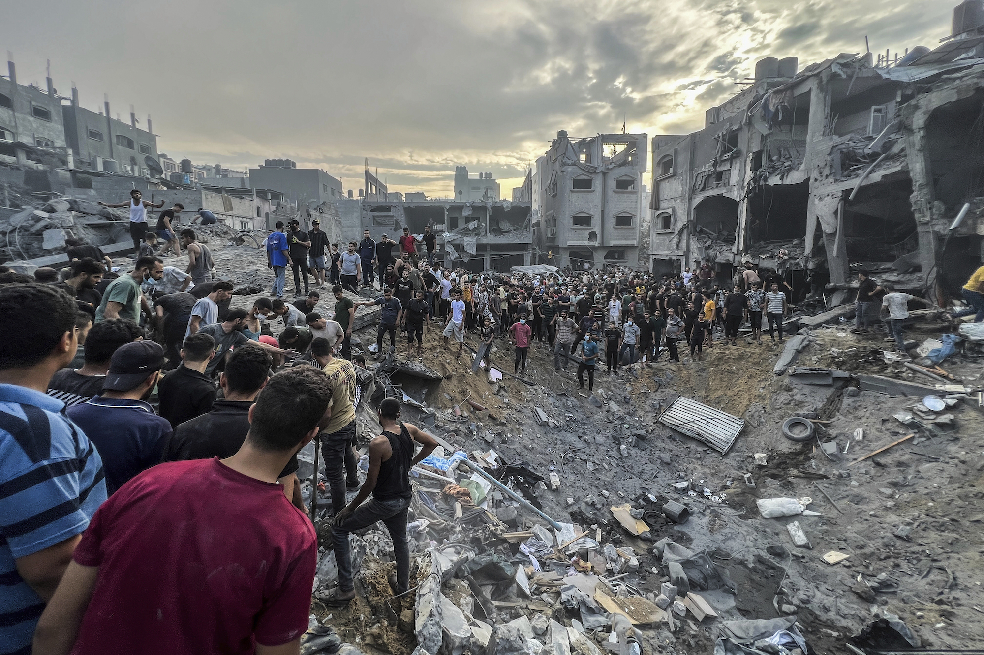 Palestinians search for survivors following an Israeli airstrike in the Jabalya refugee camp on Tuesday.