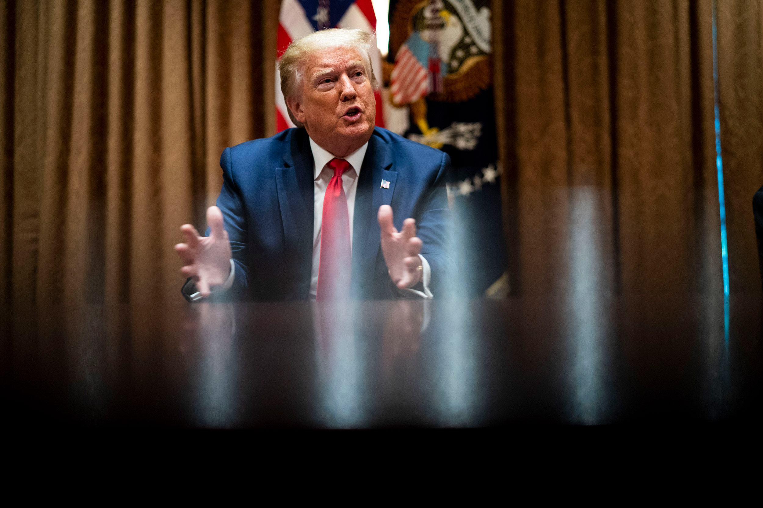 President Donald Trump speaks during a round table discussion in the Cabinet Room of the White House on June 10 in Washington.