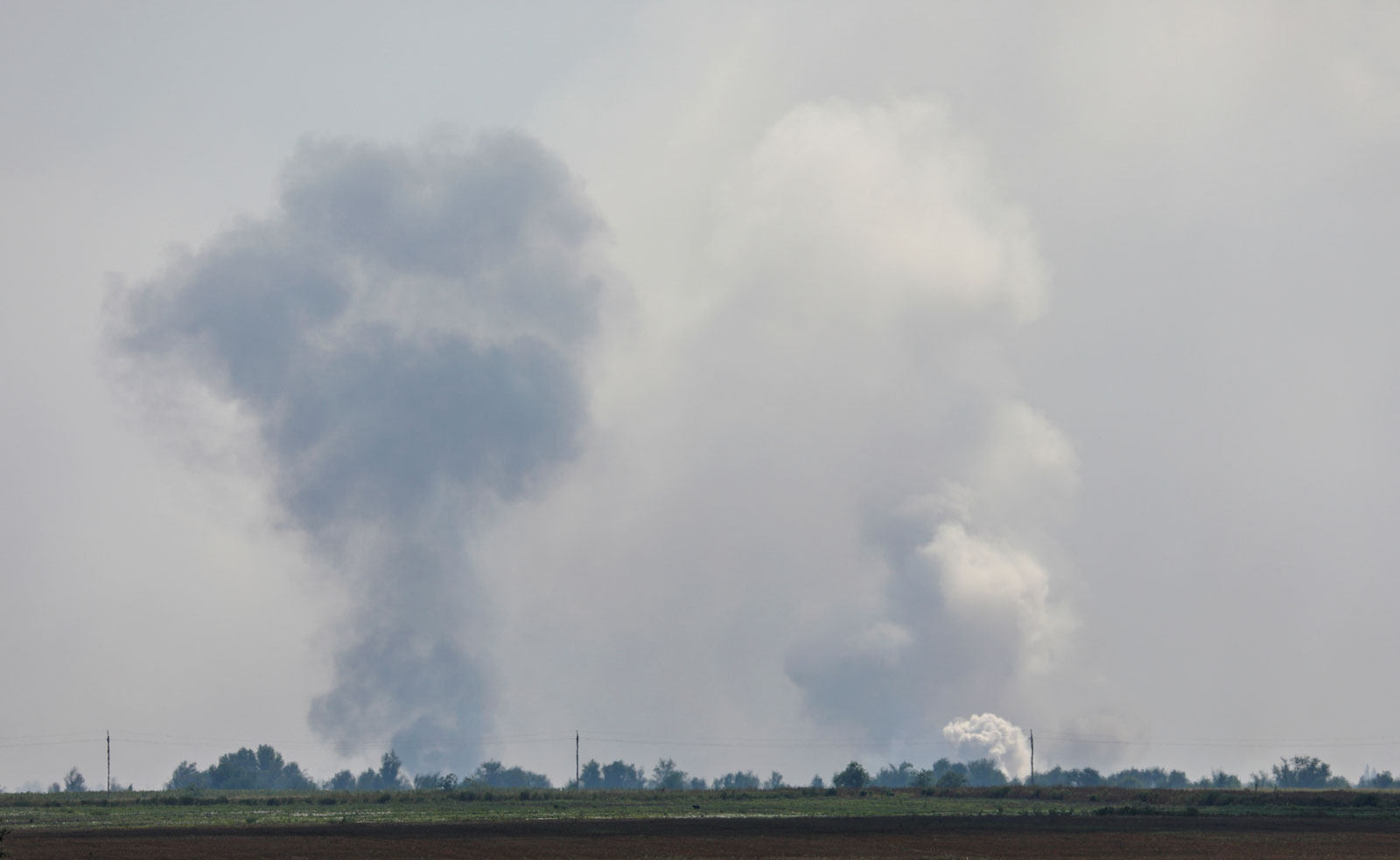 Smoke rises following an explosion in the village of Mayskoye in the Dzhankoi district, Crimea on Tuesday.