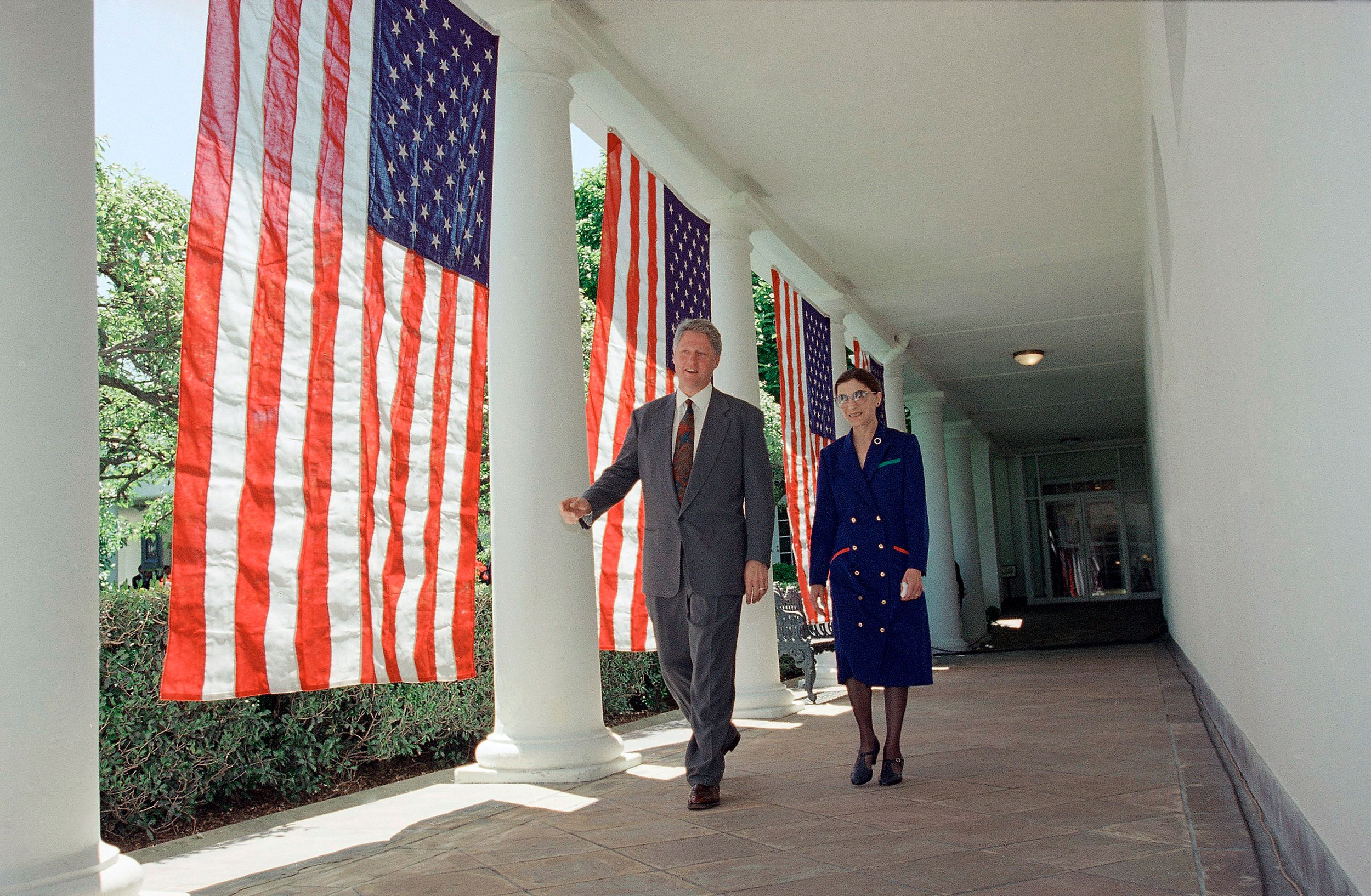President Bill Clinton and Ruth Bader Ginsburg walk along the Colonnade of the White House on June 14, 1993.