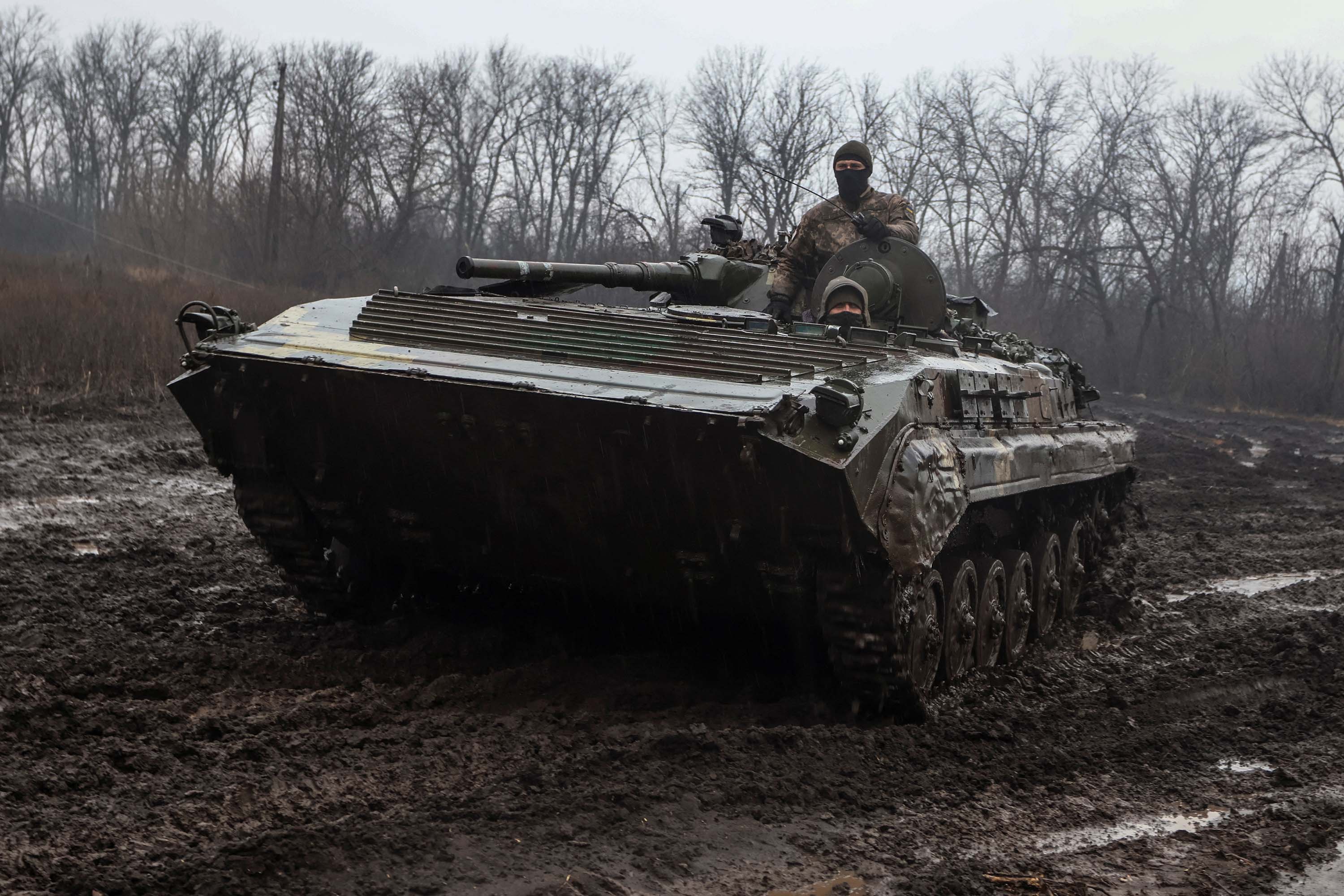 Ukrainian service members ride inside an infantry fighting vehicle near the frontline town of Bakhmut, Ukraine,on February 25. 