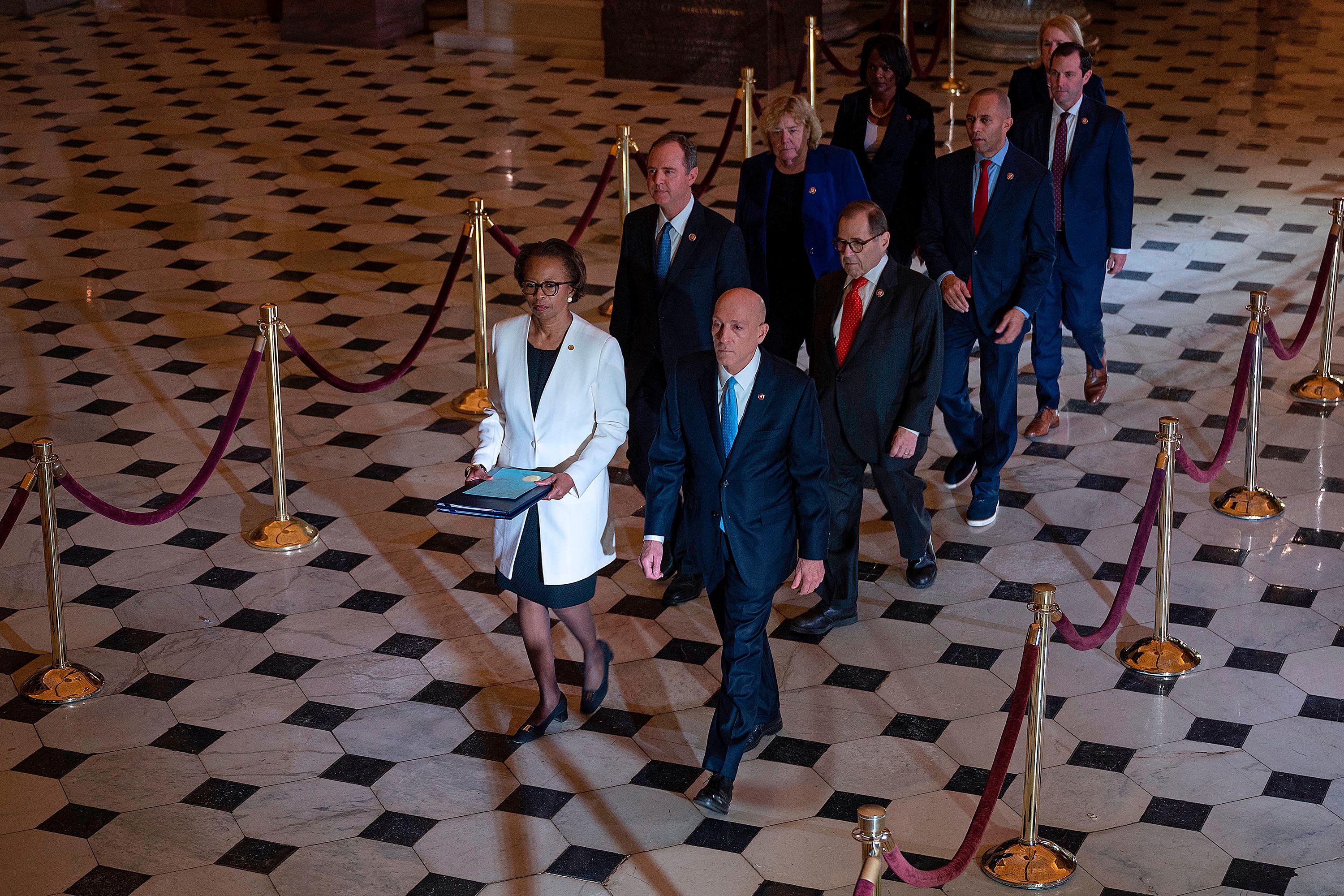 House managers walk to the US Senate to deliver the articles of impeachment against President Trump on Capitol Hill on Jan. 15.