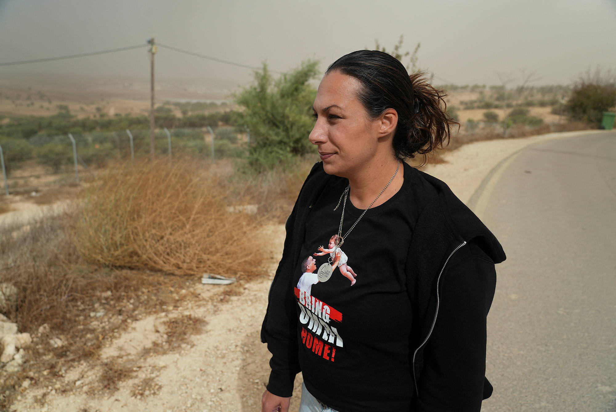 Lishay Lavi, whose husband Omri Miran was abducted by Hamas militants from Kibbutz Nahal Oz on October 7, stands on a hilltop in Kibbutz Kramim, Israel, on November 19.