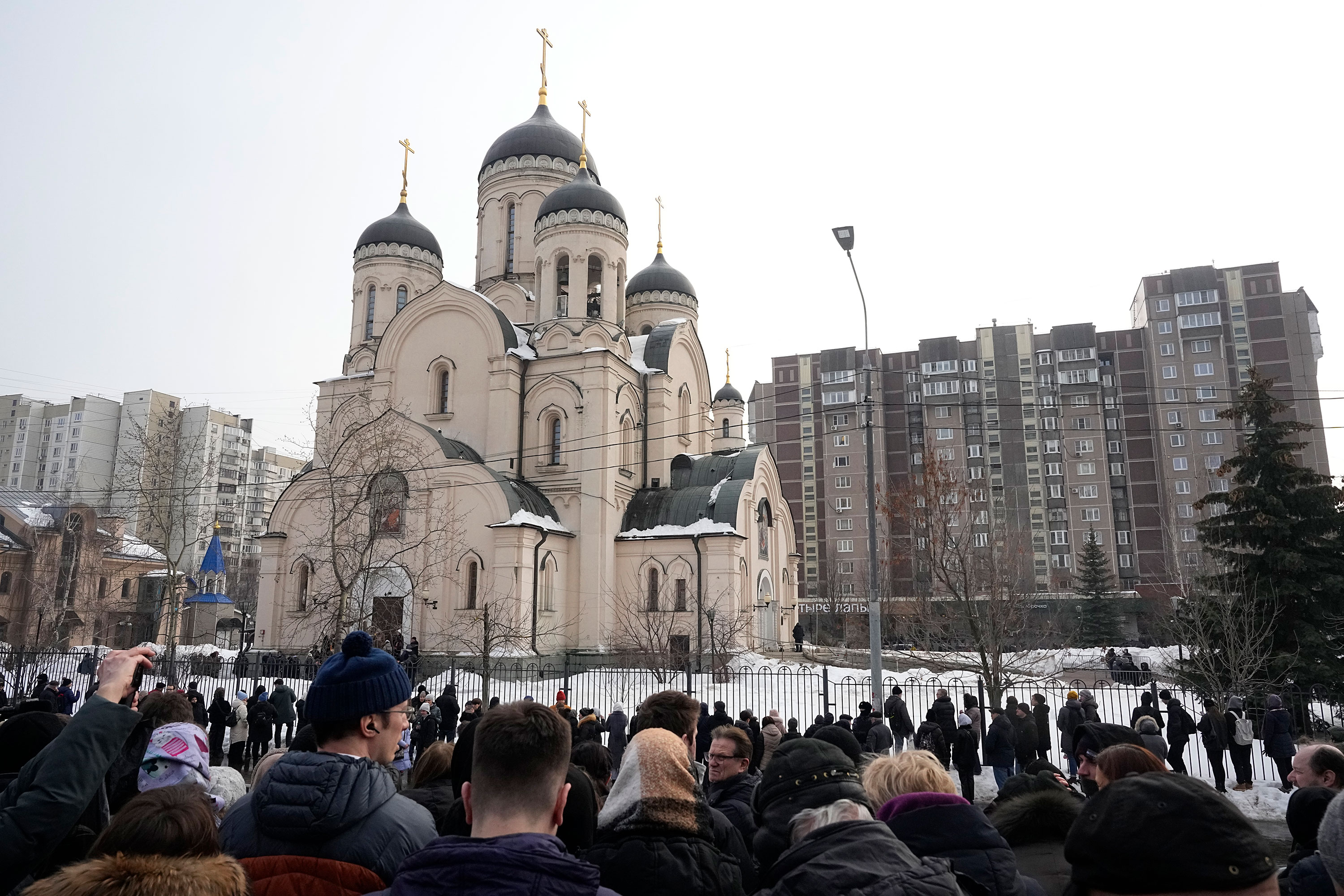 People gather outside the Church of the Icon of the Mother of God 'Quench My Sorrows' in Moscow on Friday.