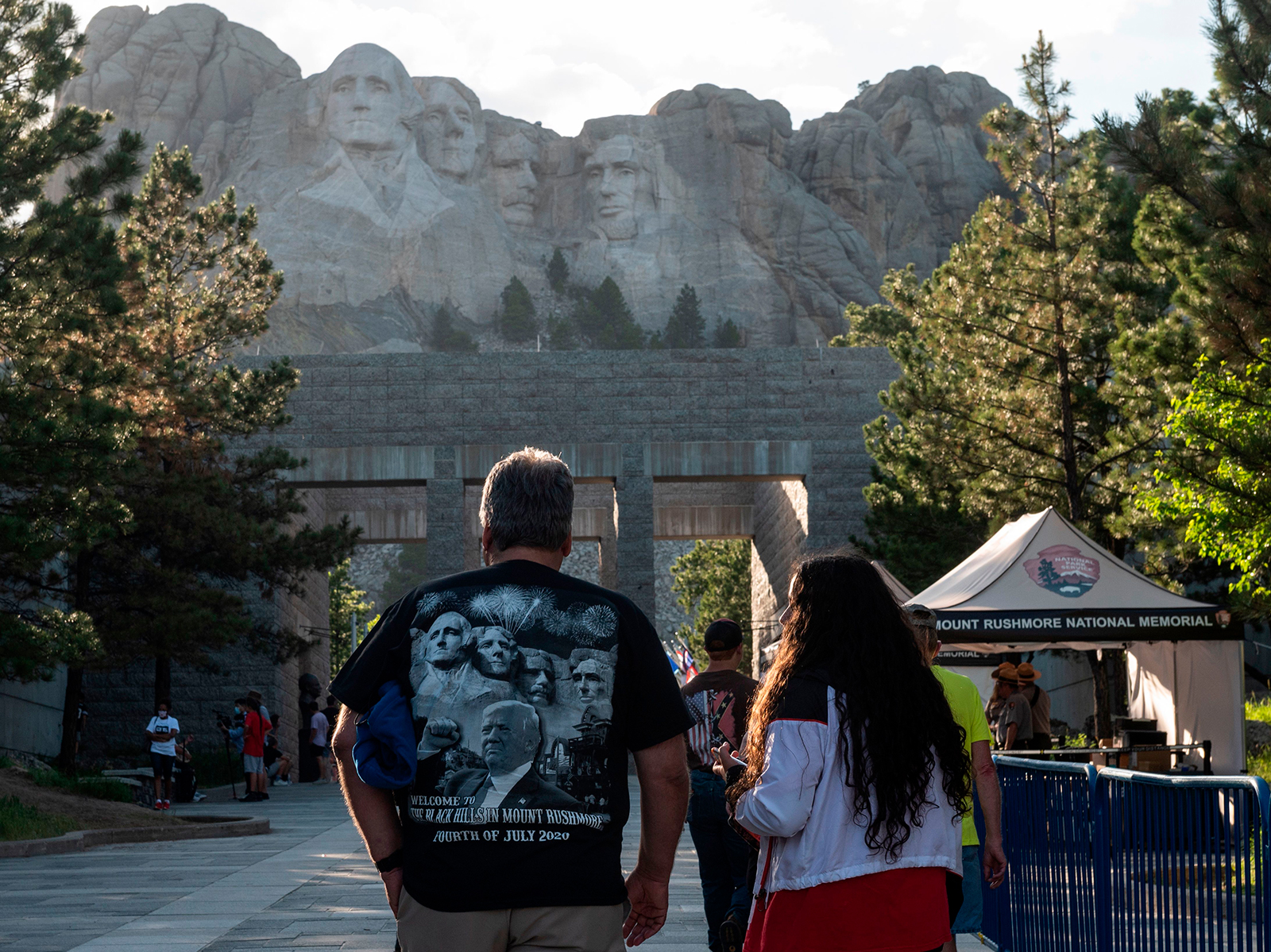 Visitors walk to see the Mount Rushmore National Monument in Keystone, South Dakota on July 2.