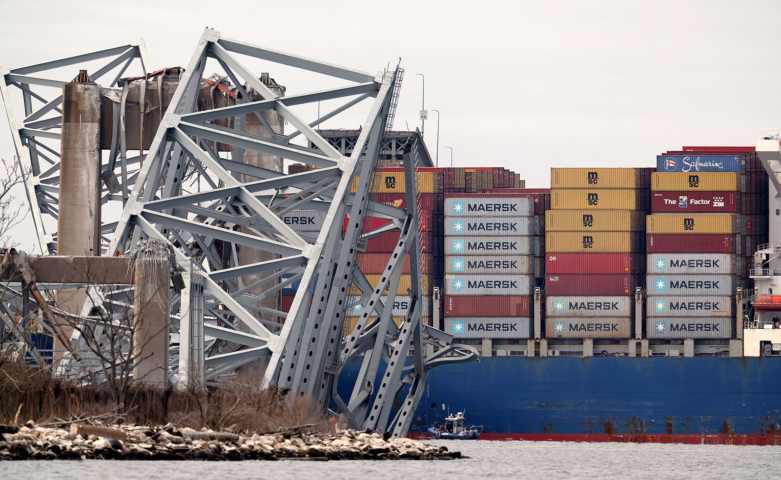 The cargo ship Dali sits in the water after running into and collapsing the Francis Scott Key Bridge on Tuesday in Baltimore. 