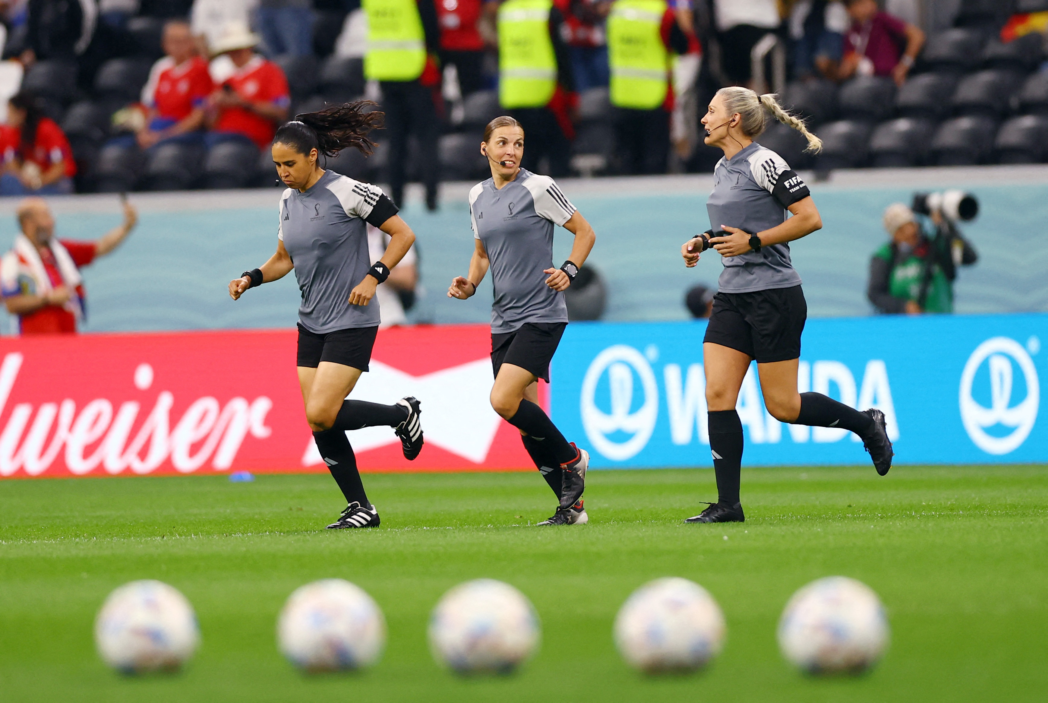 Referee Stéphanie Frappart warms up alongside assistant referees Neuza Back and Karen Diaz Medina before the match between Costa Rica and Germany in Al Bayt Stadium in Al Khor, Qatar on December 1.