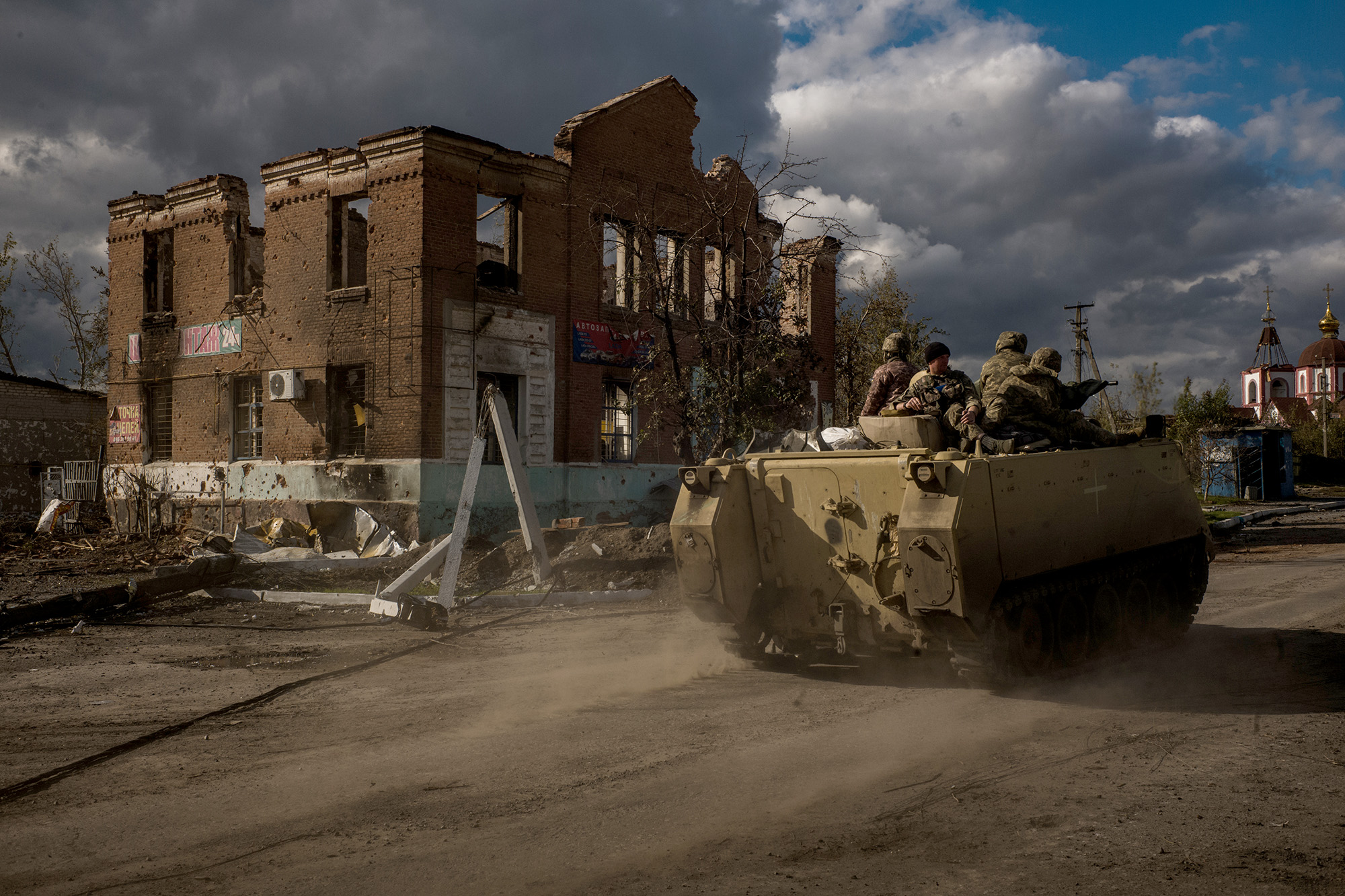 A Ukrainian armored personnel carrier drives through the destroyed village of Shandryholove near Lyman, Ukraine, on October 3.