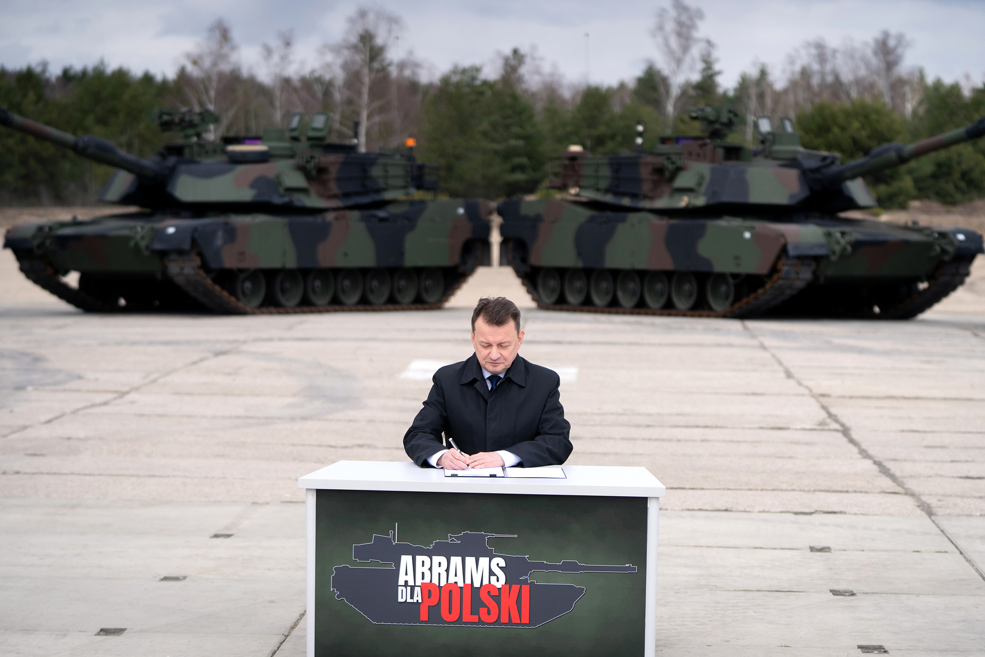 Polish Defense Minister Mariusz Blaszczak signs a contract for the purchase of 250 Abrams tanks for the Polish Army in the 1st Warsaw Armored Brigade in Wesola near Warsaw, Poland, on April 5.
