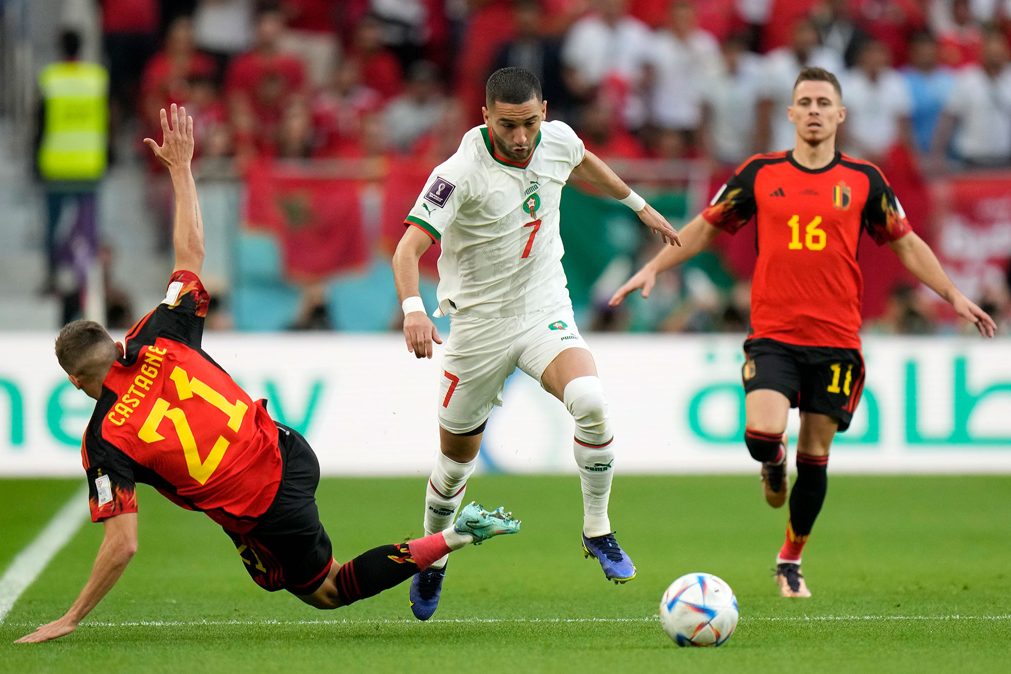Morocco's Hakim Ziyech and Belgium's Timothy Castagne fight for the ball during their match on Sunday, November 27. 