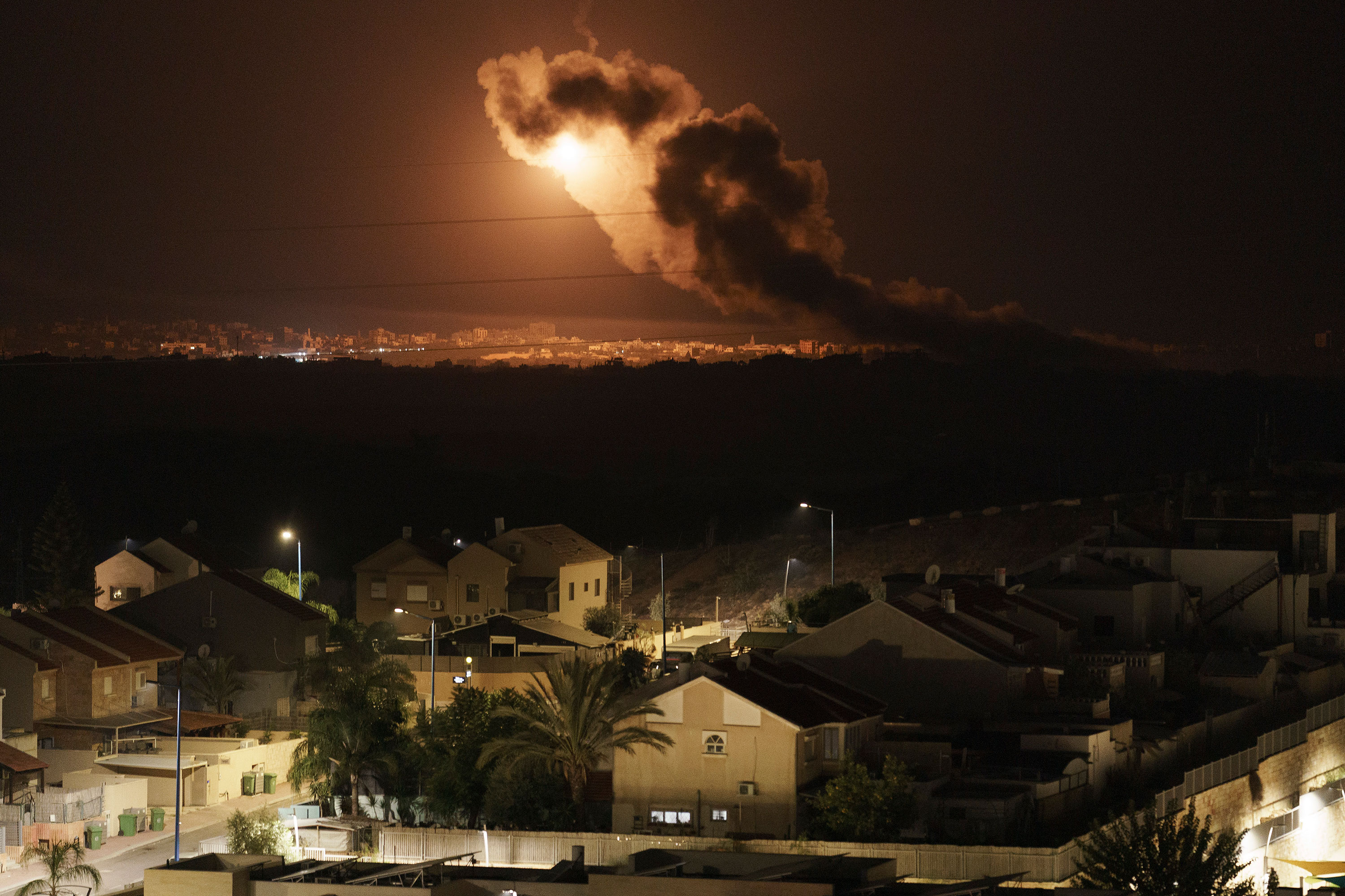 Smoke and flares rise over Gaza City, as seen from southern Israel, on Friday. 