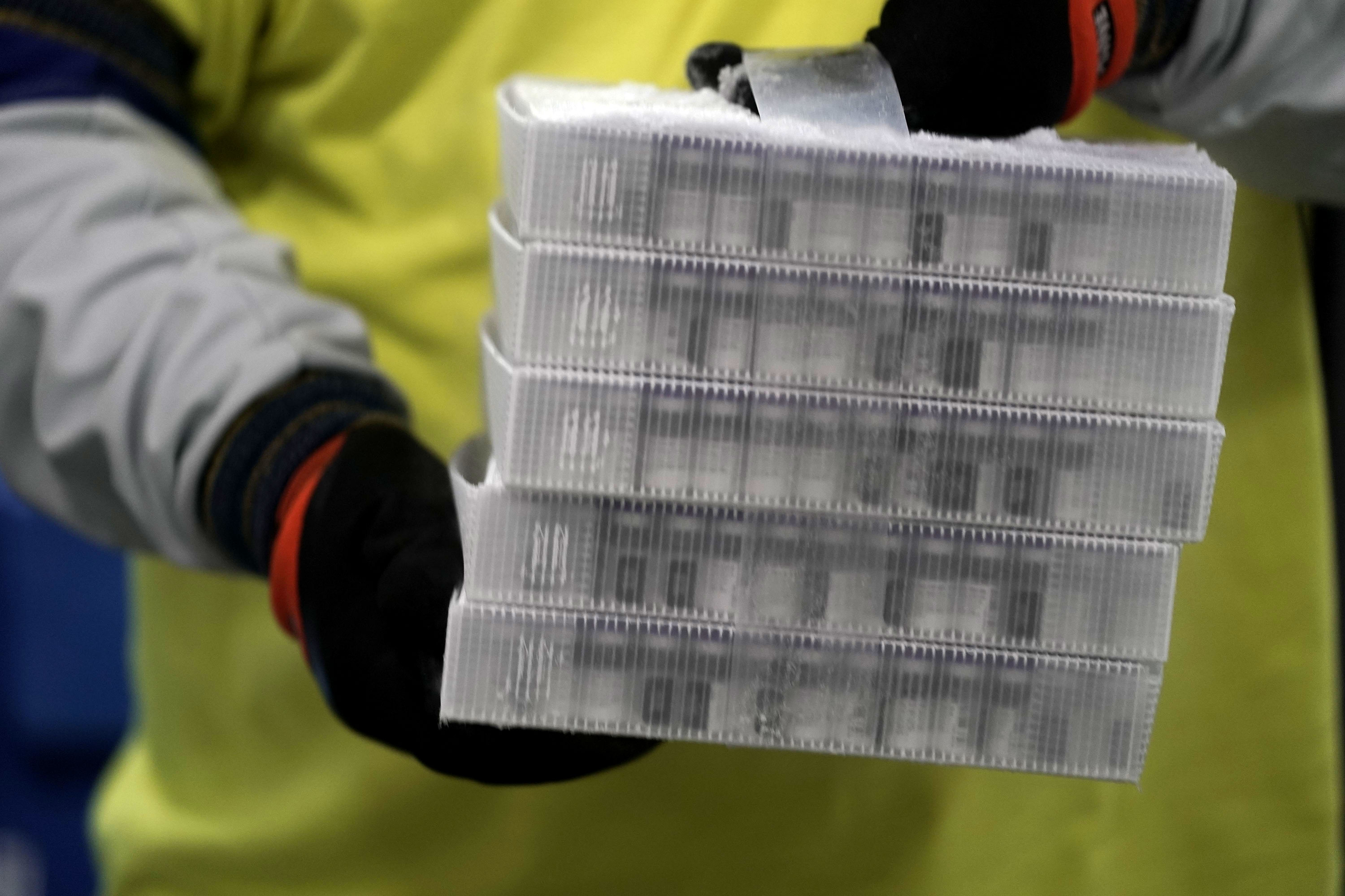 Vials of the Pfizer-BioNTech Covid-19 vaccine are prepared to be shipped at the Pfizer manufacturing plant in Kalamazoo, Michigan on December 13.