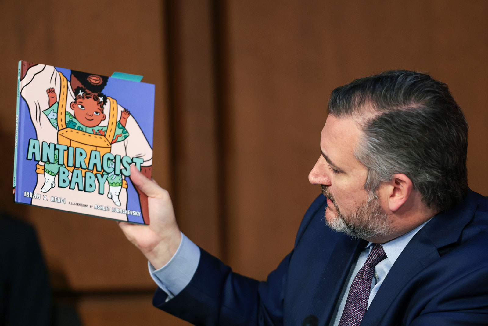 Sen. Ted Cruz holds up a book as he questions Supreme Court nominee Judge Ketanji Brown Jackson during her confirmation hearing.