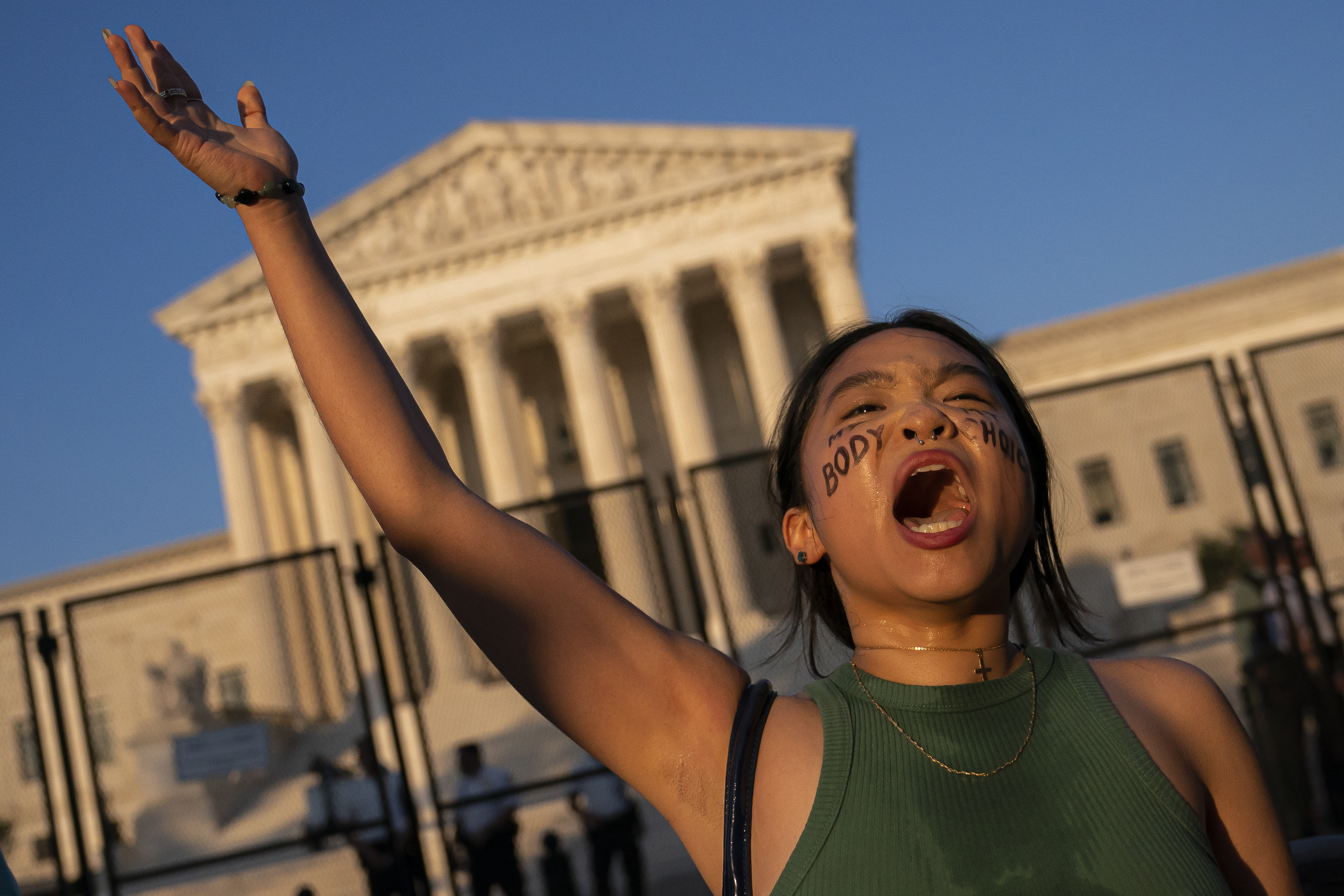 Abortion right demonstrator Robin Gwak chants in front of the Supreme Court building on Saturday following the overturning of Roe v Wade.
