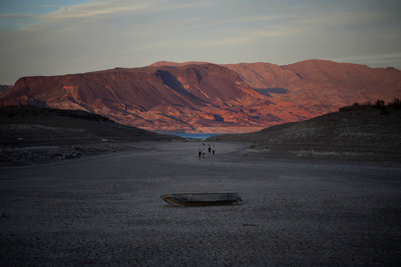 A previously sunk boat lies on the dry lake bed of Lake Mead in May.
