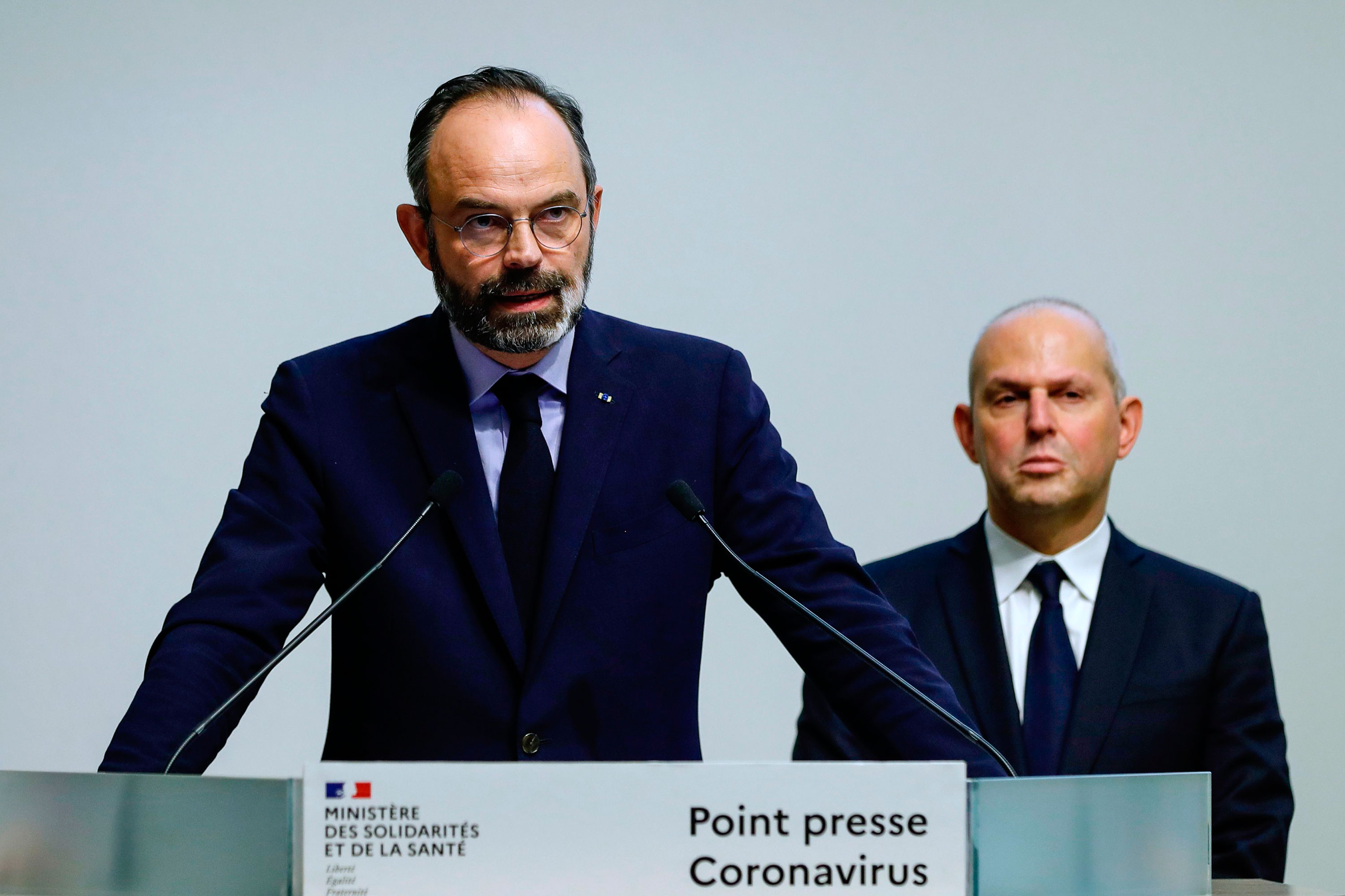 French Prime Minister Édouard Philippe announces new measures to limit the spread of coronavirus on March 14 in Paris.
