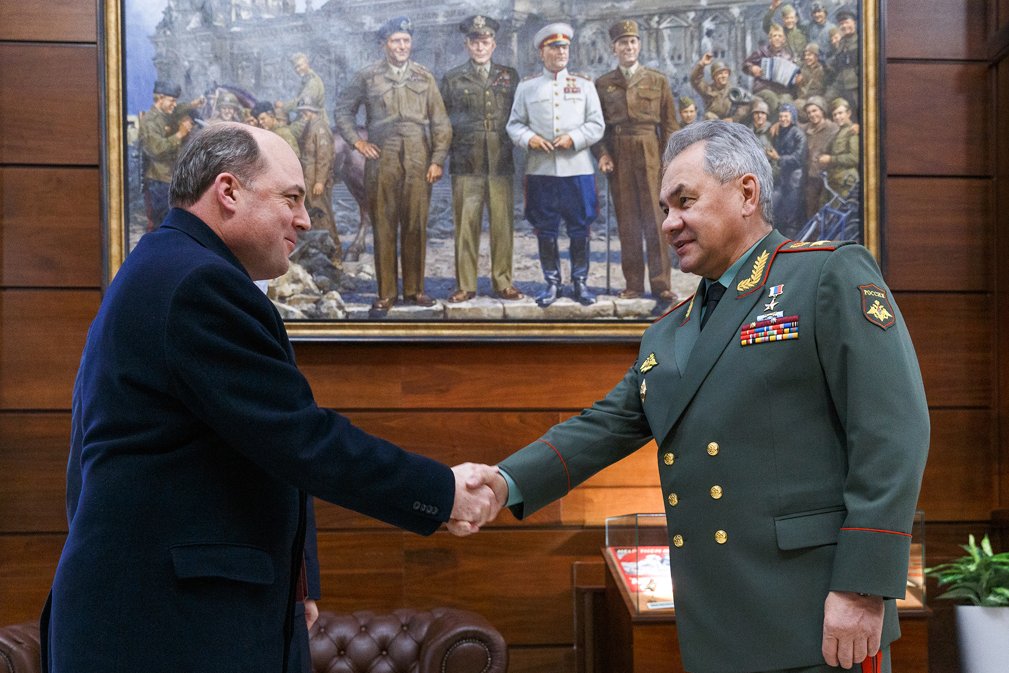 British Defense Secretary Ben Wallace (L) and Russian Defense Minister Sergei Shoigu shake hands during talks at the Russian Defense Ministry headquarters in Moscow, Russia, on February 11.