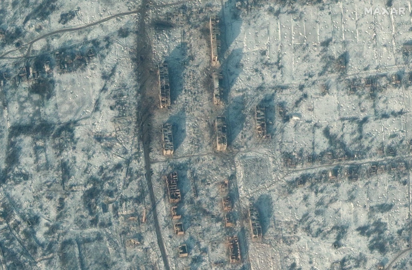 Satellite imagery shows destroyed apartment buildings and homes in Soledar on January 3, 2022.