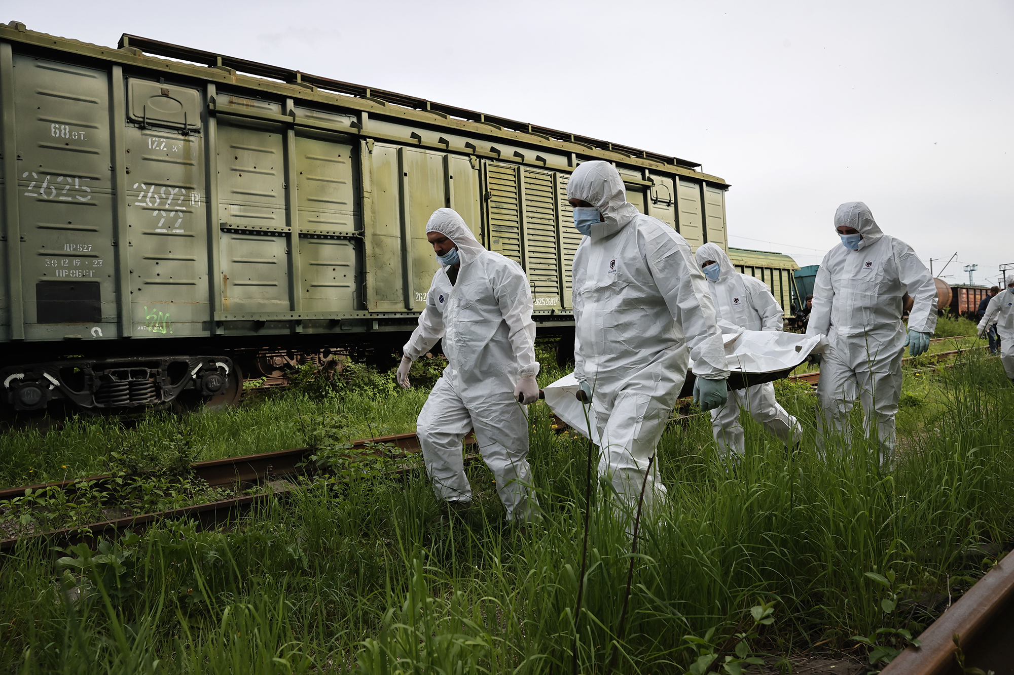 Forensic workers transport the bodies of Russian soldiers in Kyiv, Ukraine, on May 13. 