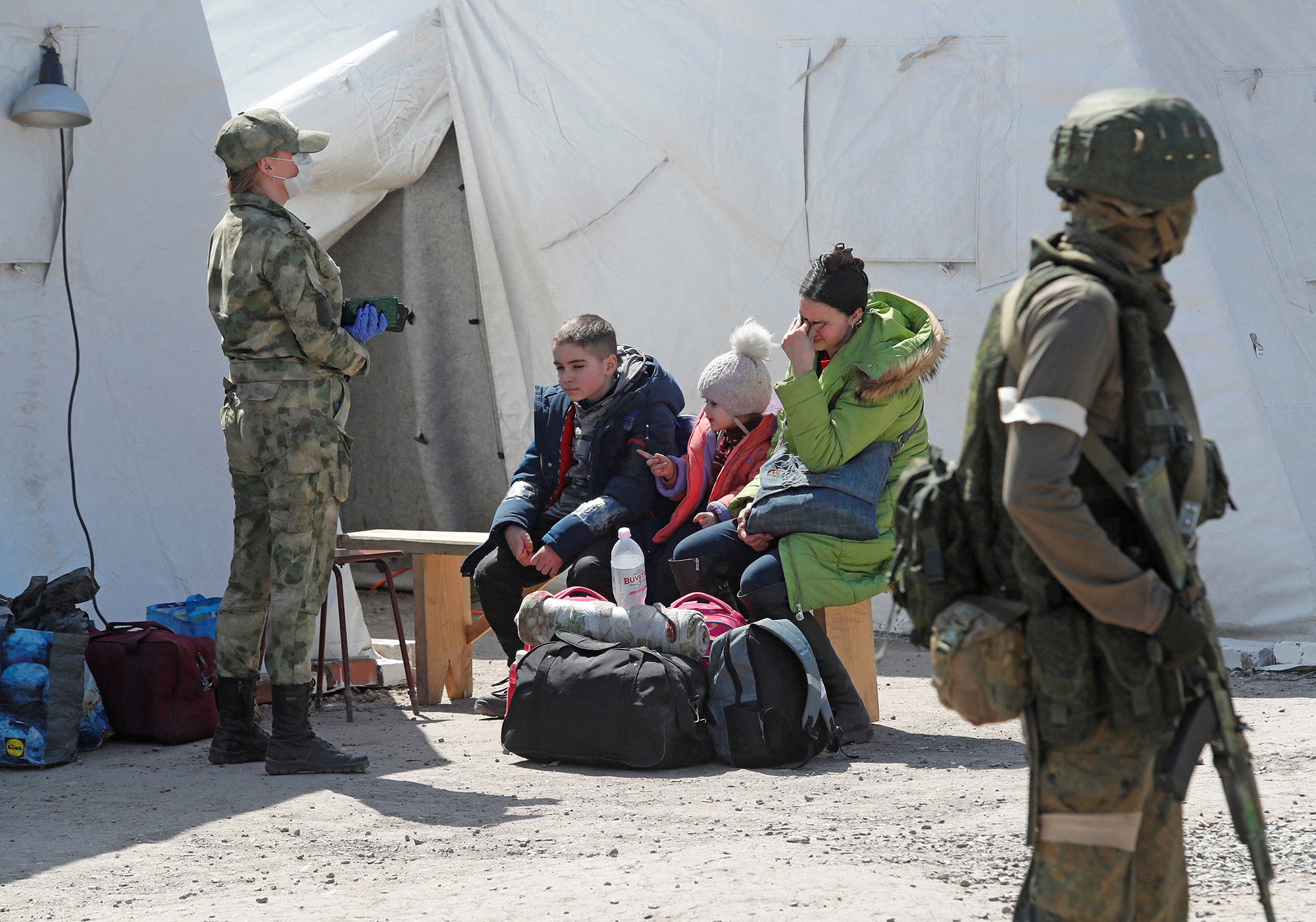 Evacuees, including civilians who left the area near the Azovstal steel plant in Mariupol, arrive in the Russian-held town of Bezimenne, in the Donetsk Region of Ukraine, on May 1.
