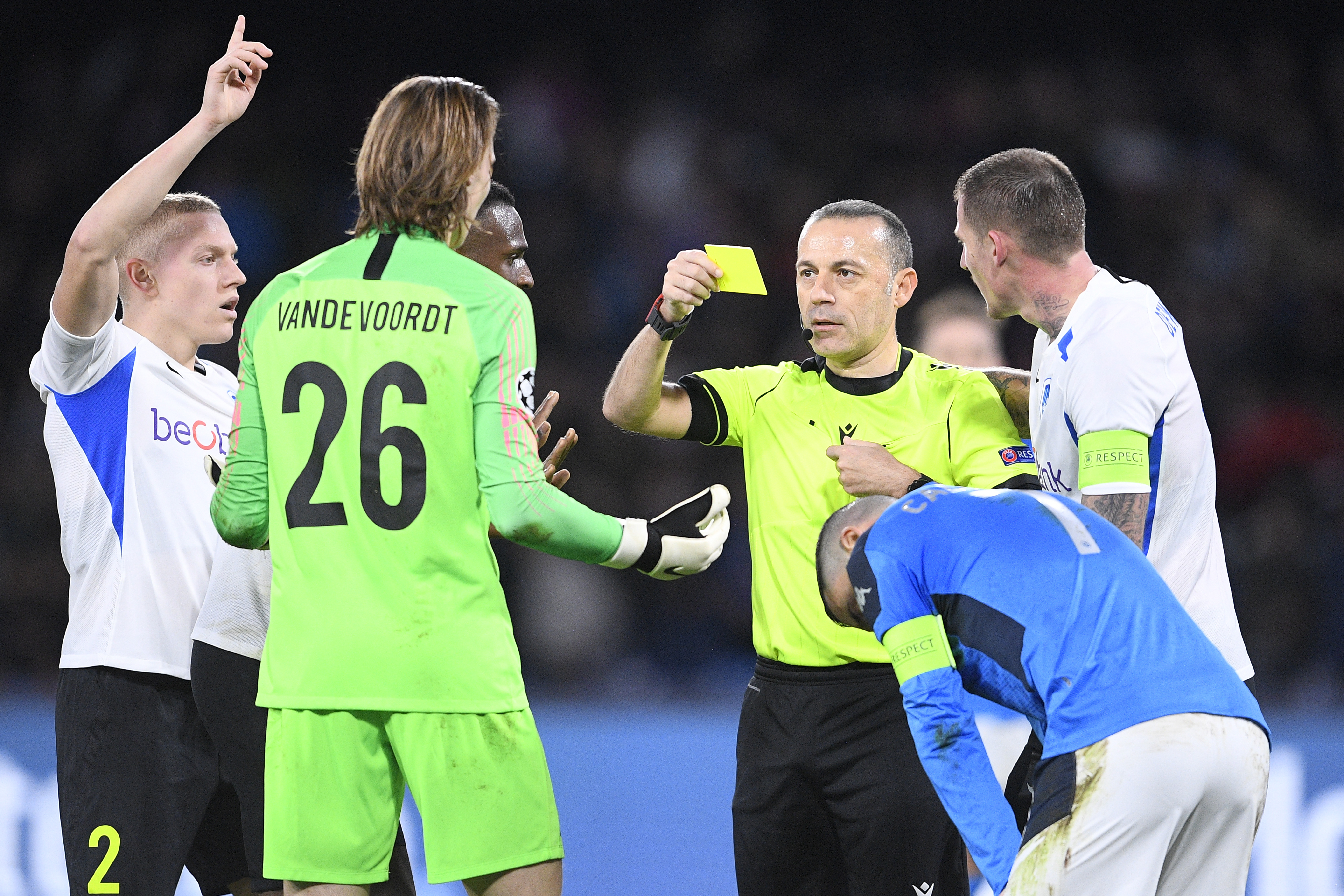 Maarten Vandevoordt receives a yellow card after conceding a penalty.