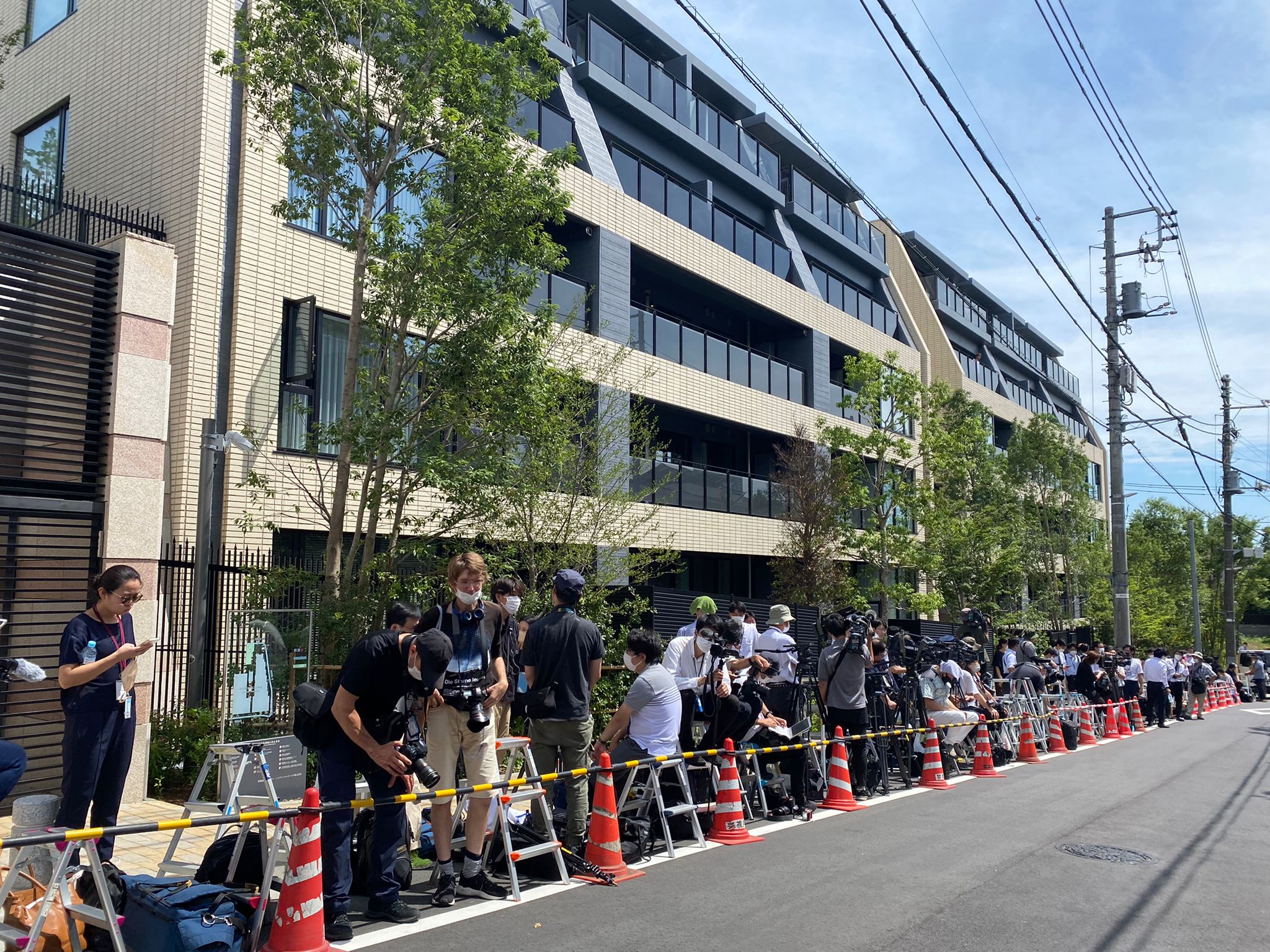 Journalists gather outside the Abe family residence in Tokyo on Saturday.