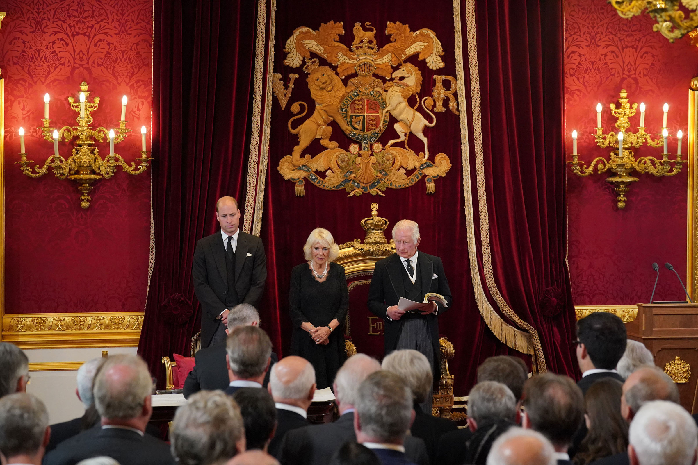 The UK's King Charles III speaks in the Throne Room at St. James's Palace during the Accession Council in London on Saturday. Joining him were his son Prince William and his wife Camilla, the Queen Consort.