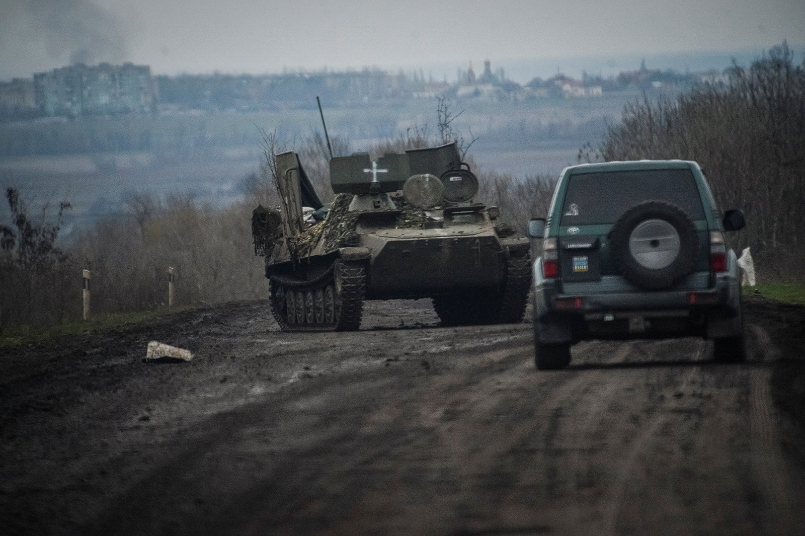 Ukrainian service members ride military vehicles near the front line city of Bakhmut, Ukraine on April 6.