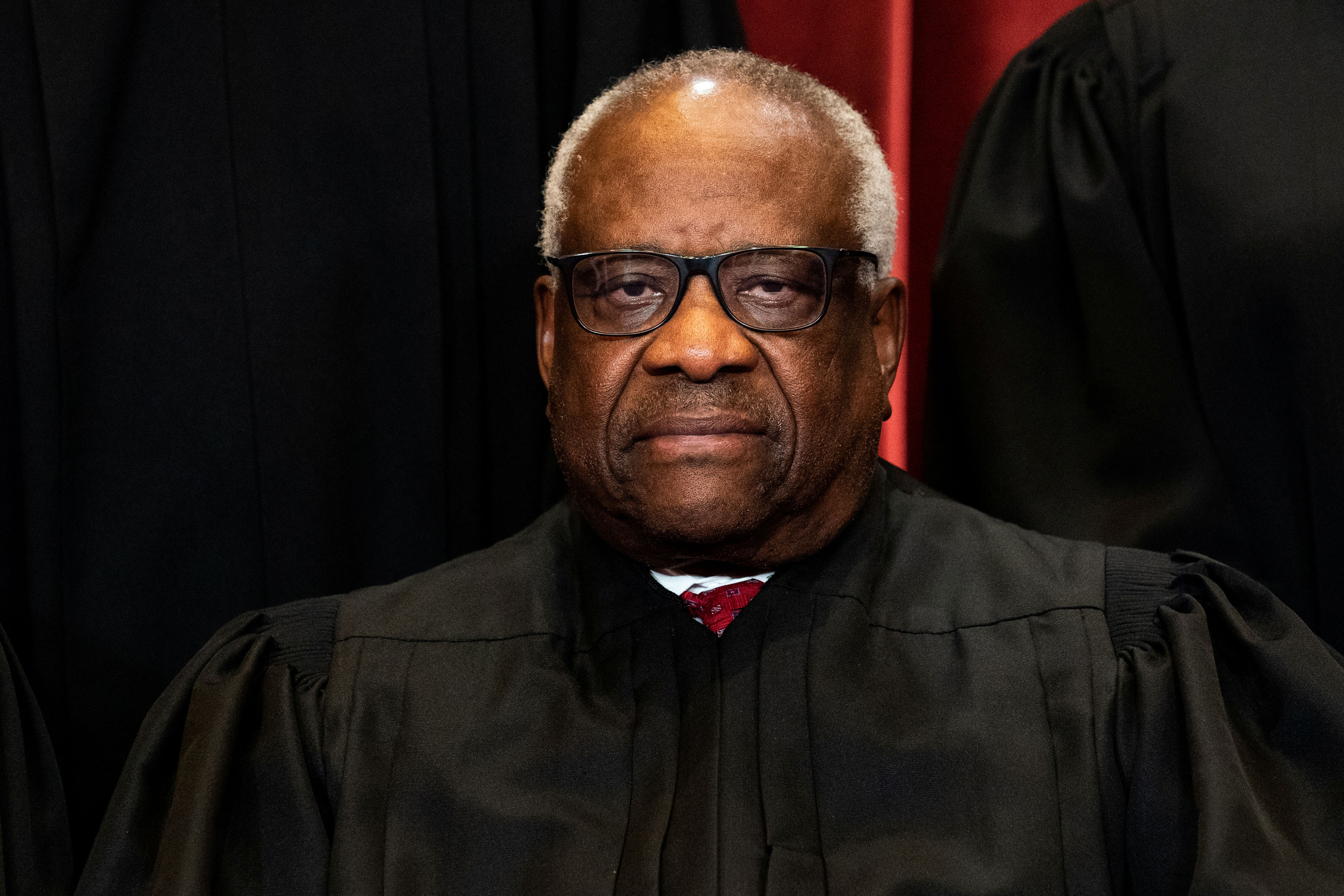 Associate Justice Clarence Thomas poses during a group photo at the Supreme Court in Washington in 2021.