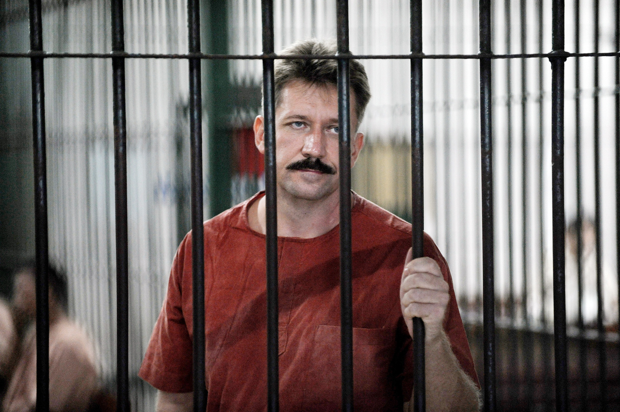 Russian arm dealer Viktor Bout looks from behind bars at the Criminal Court in Bangkok, Thailand, on October 10, 2008. 