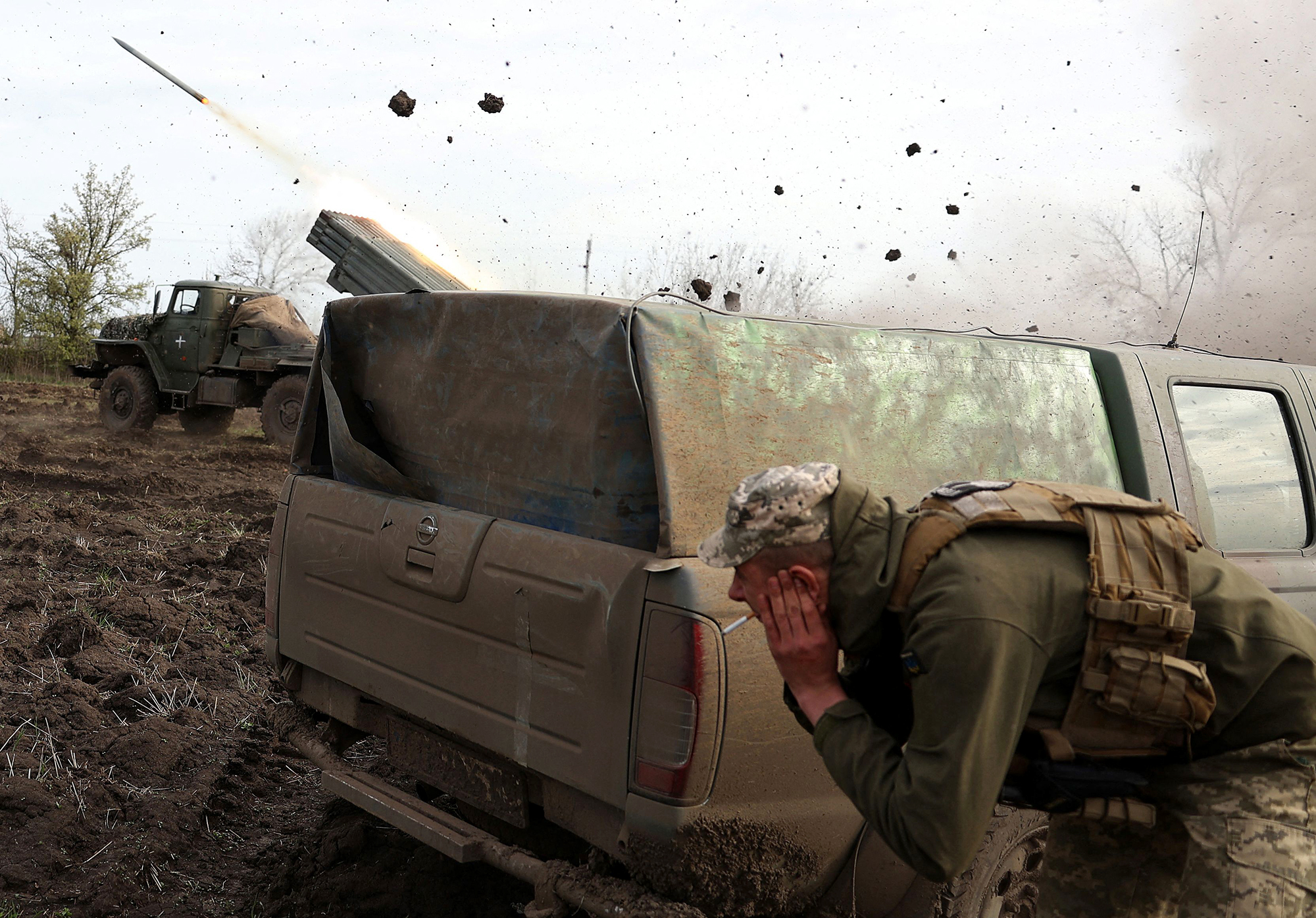 Ukrainian soldiers fire towards Russian positions near Bakhmut, Ukraine, on April 18. 