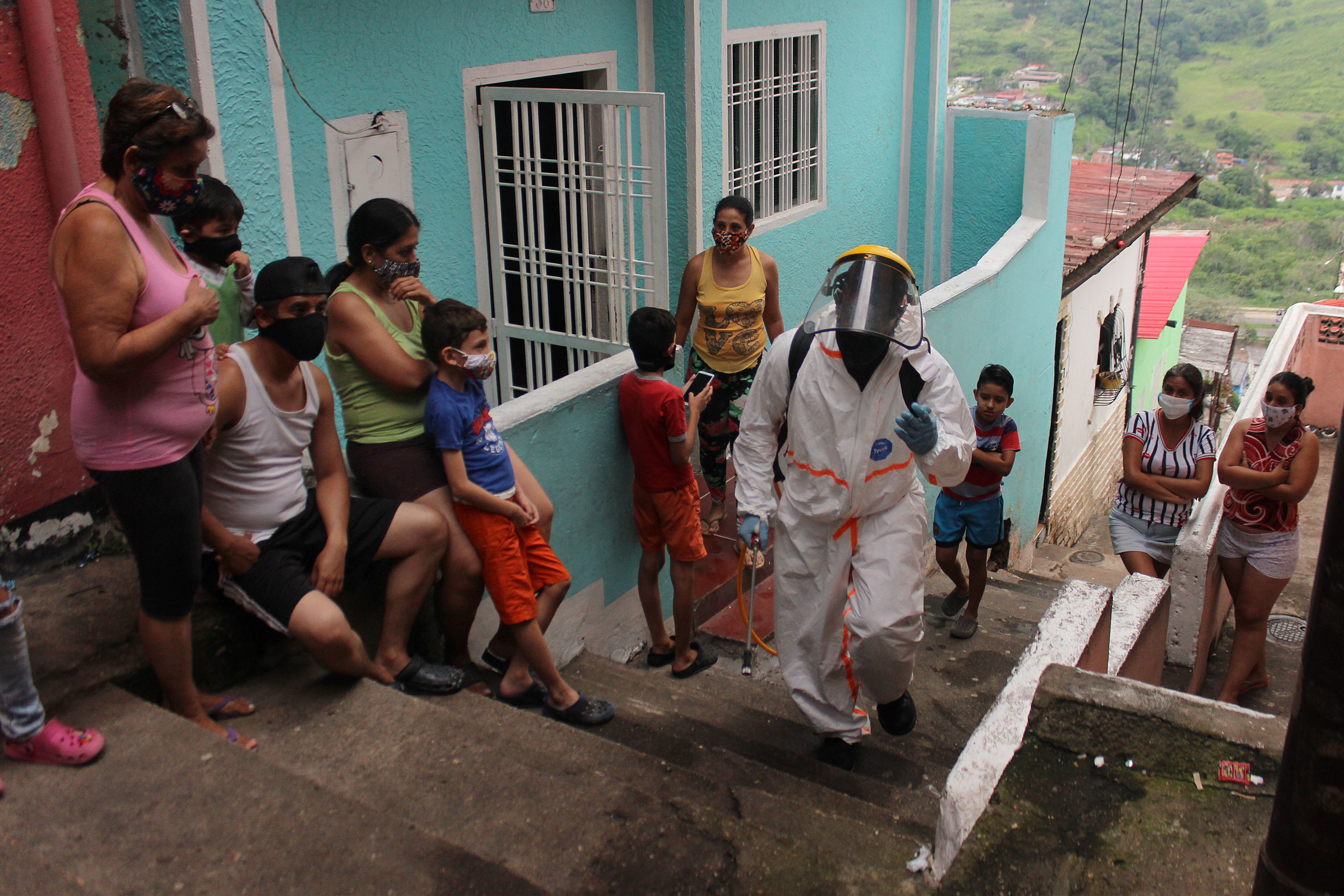 Health care personnel work on disinfecting in San Cristóbal, Venezuela, on August 9.
