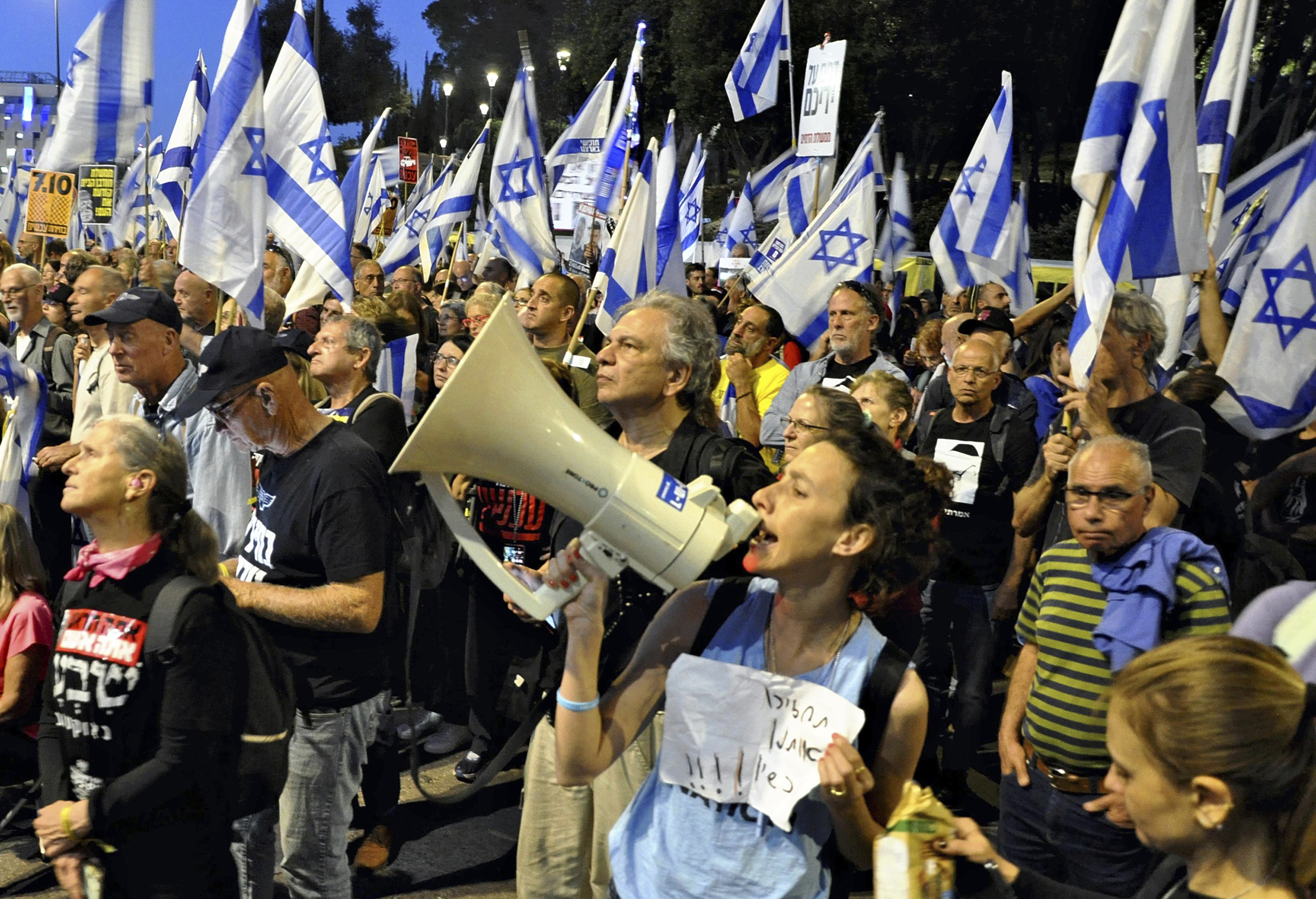People protest against Israeli Prime Minister Benjamin Netanyahu's government and call for his retirement in Jerusalem on March 31.