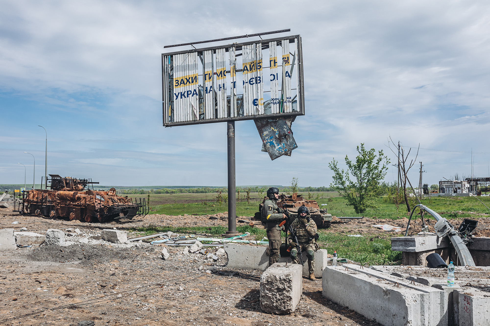 Two Ukrainian soldiers keep watch at a checkpoint in the Kharkiv region, Ukraine, on May 12.