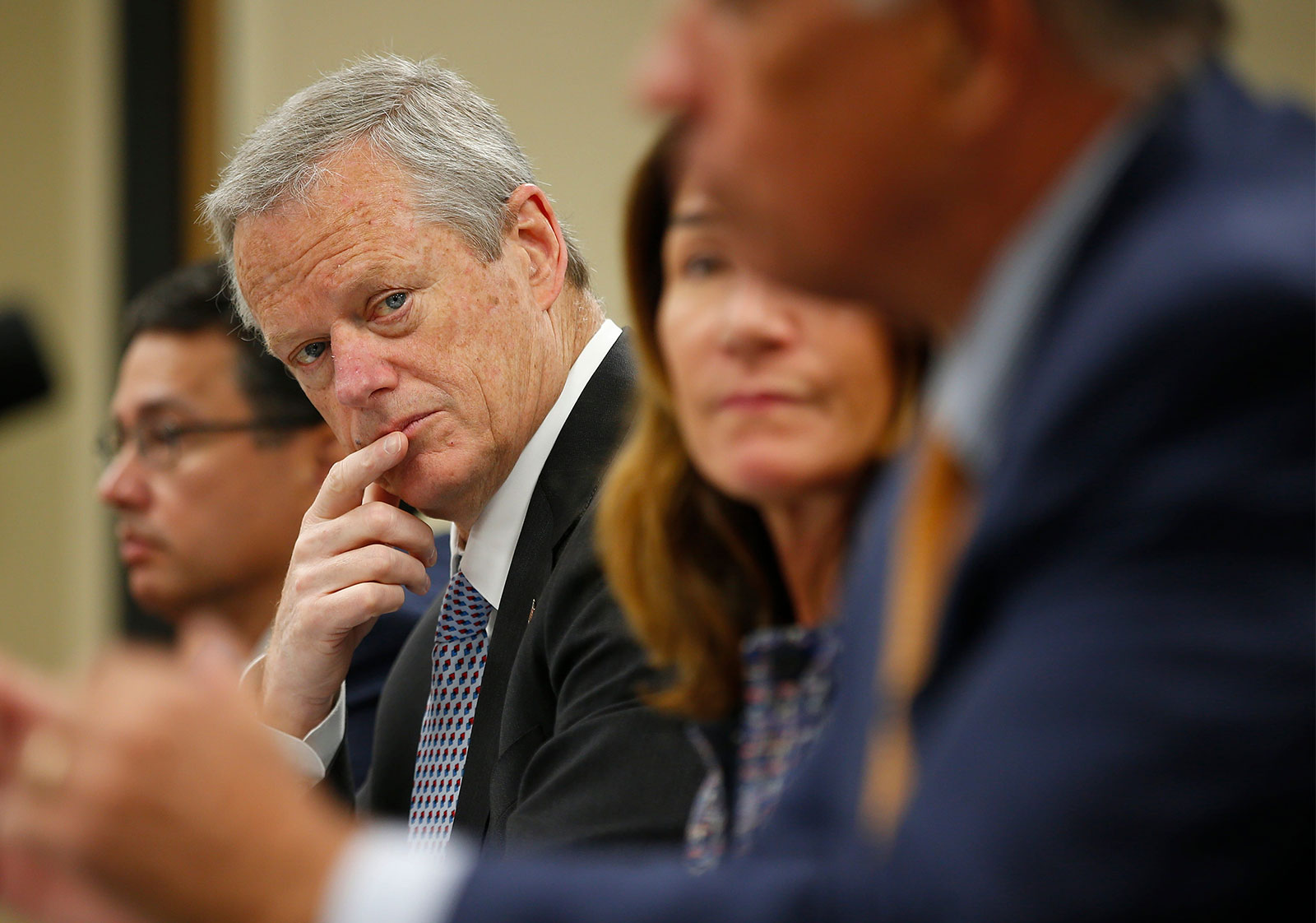 Massachusetts Gov. Charlie Baker listens during a roundtable discussion held at UMass Law in Dartmouth, Massachusetts, on June 7.