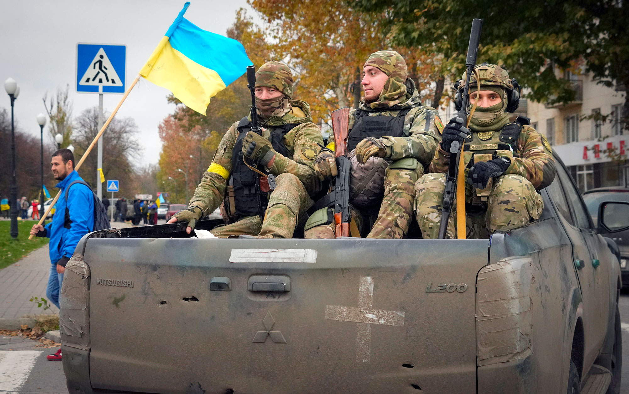 Ukrainian soldiers sit in a truck in Kherson, Ukraine, on November 13. 