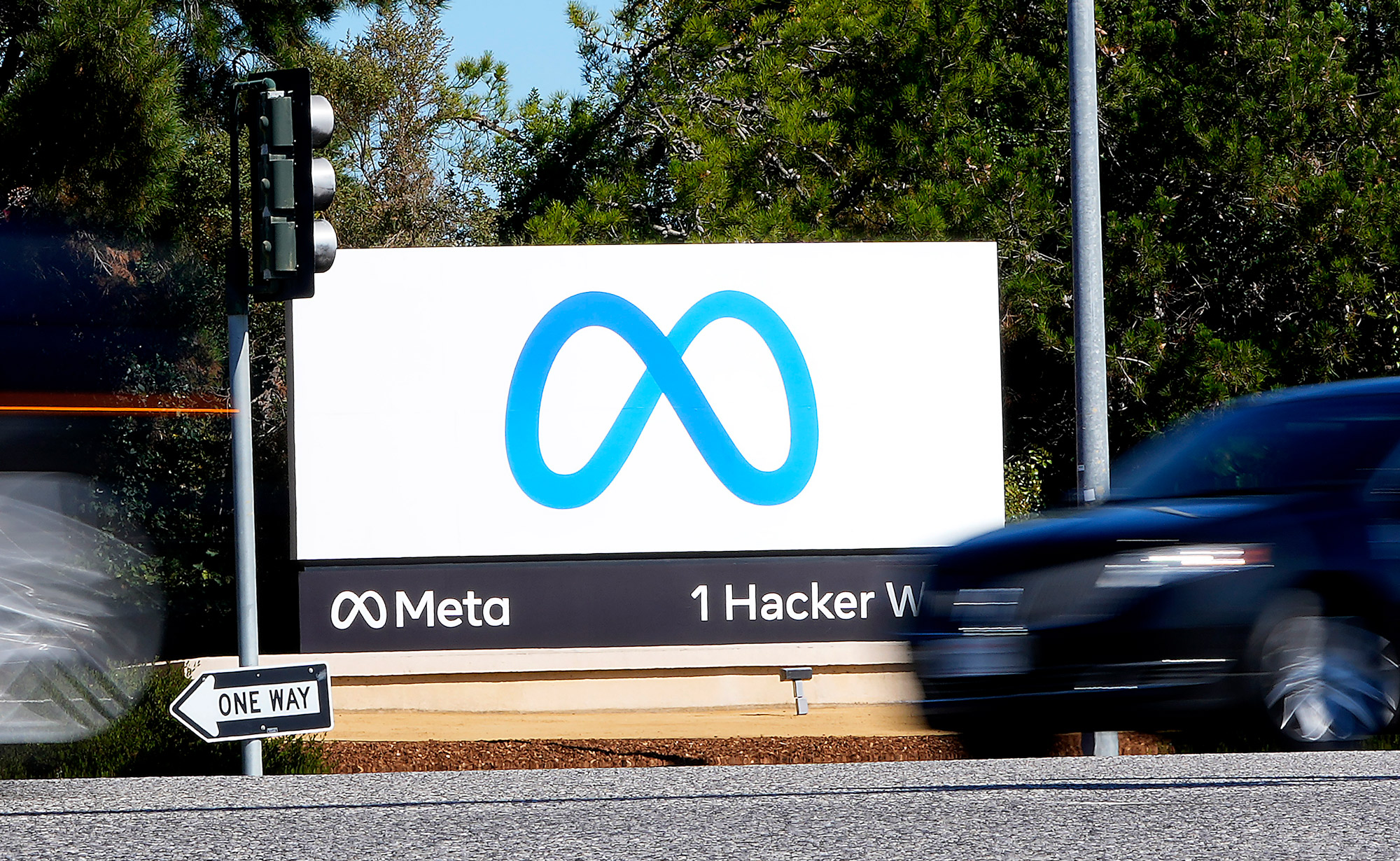 Meta's logo is seen on a sign at the company headquarters in Menlo Park, California, on October 28, 2021. 
