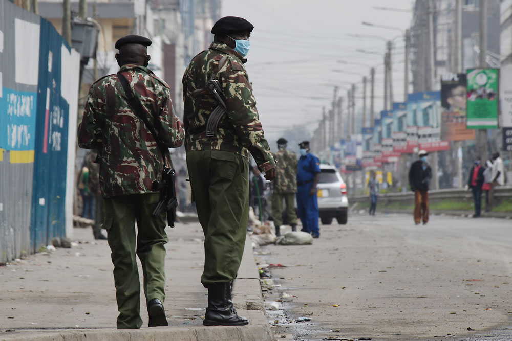 Kenyan police officers patrol in Eastleigh, Nairobi, on May 7, during the government partial lockdown. 
