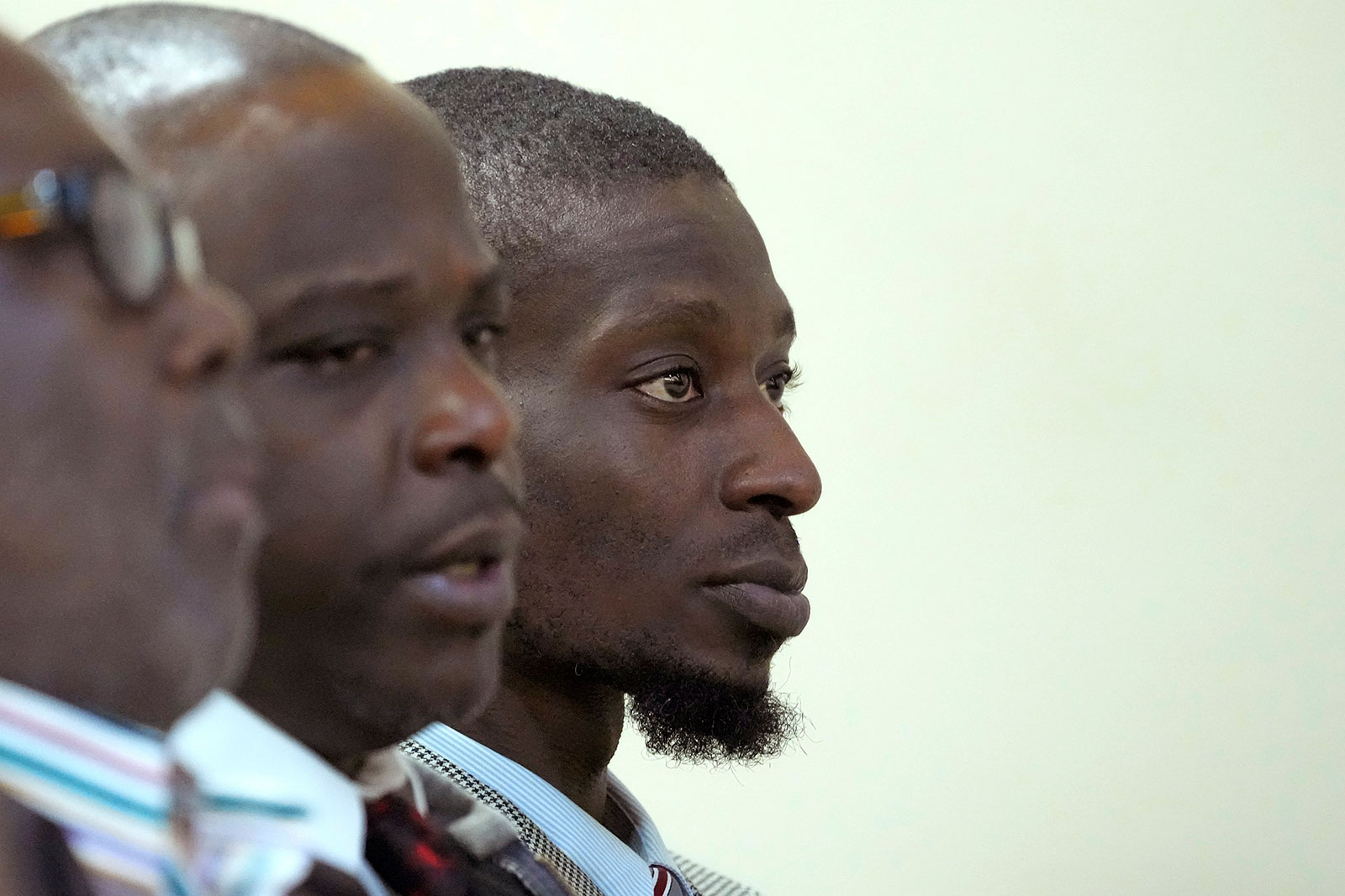 Michael Corey Jenkins, right, and Eddie Terrell Parker, center, sit in a Rankin County courtroom on Wednesday in Brandon, Mississippi. 