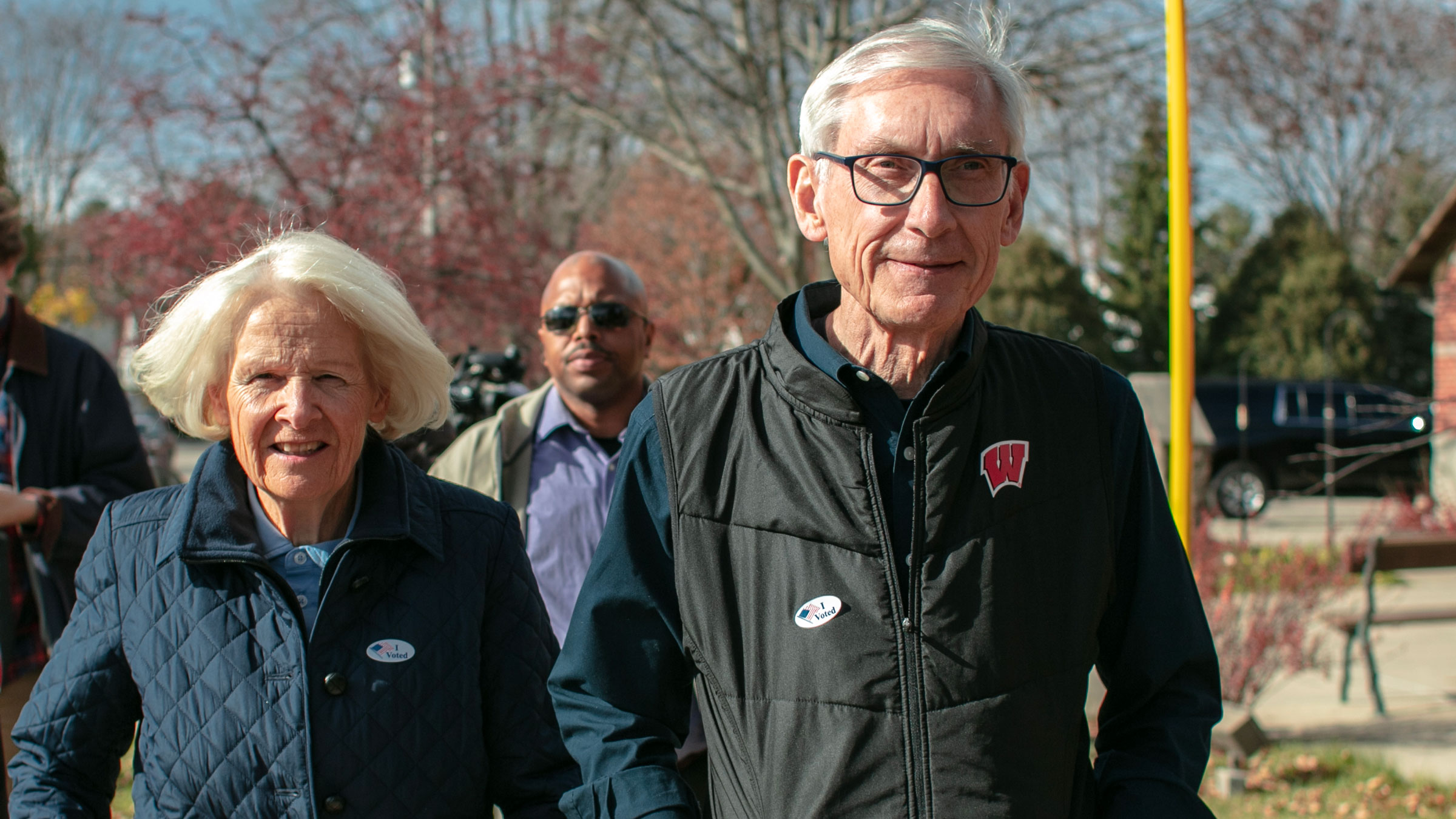 Wisconsin Gov. Tony Evers and his wife, Kathy, leave a polling place in Madison on Tuesday.