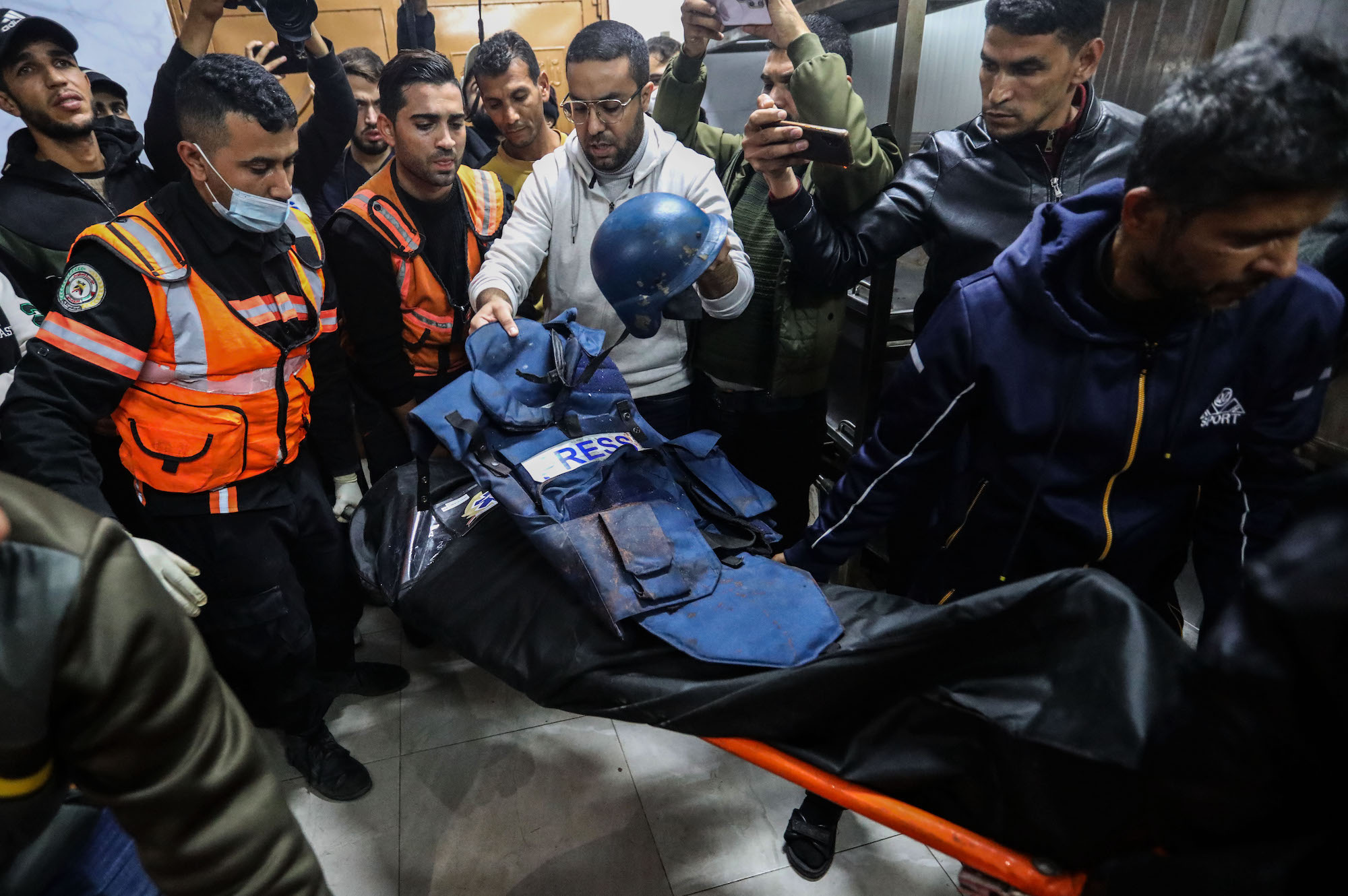 The stretcher carrying the body of Al Jazeera TV cameraman Samer Abu Daqqa, who was killed while working in an airstrike,  in Khan Younis, Gaza, on Friday.