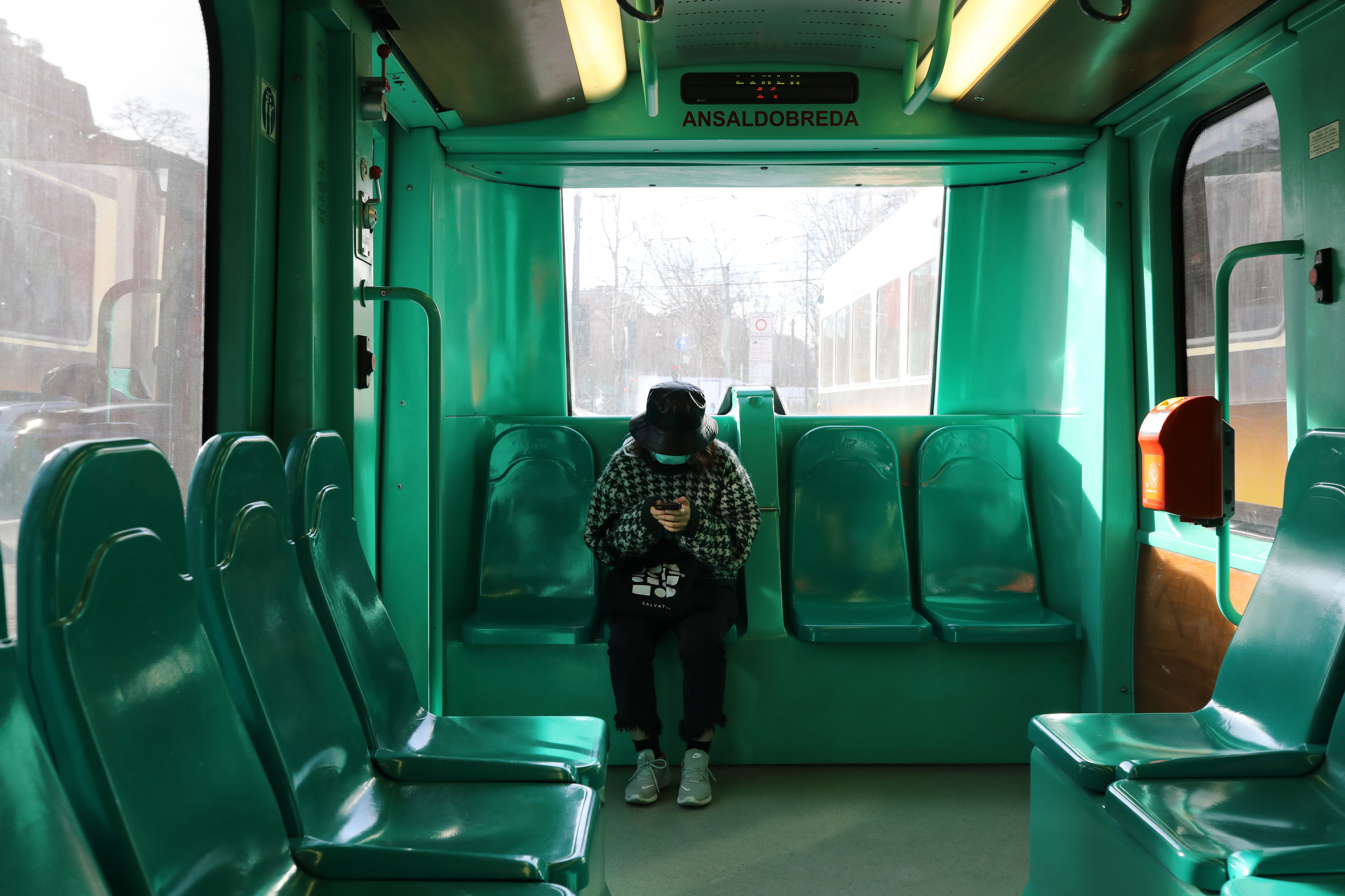 A woman wearing a protective mask seen on public transport on Thursday in Milan, Italy.