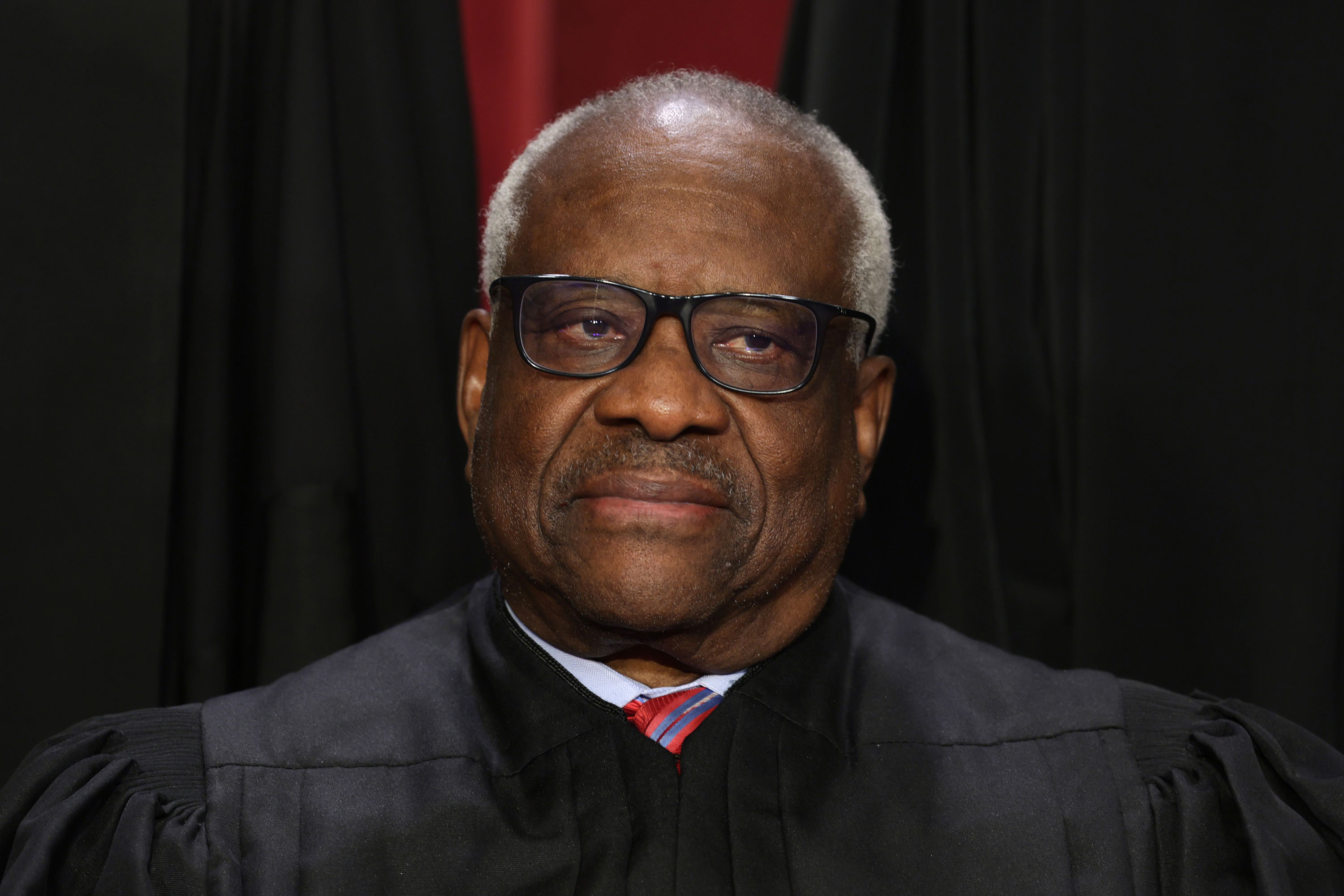 Justice Clarence Thomas poses for an official portrait in October 2022.
