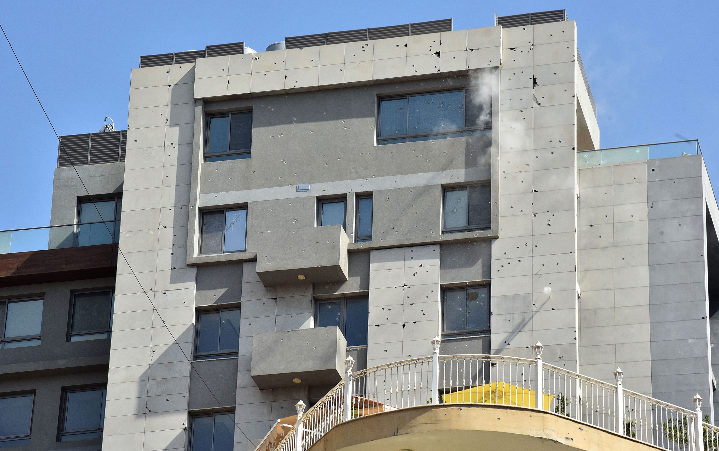 Bullets hit a building amidst clashes in Beirut on Thursday.