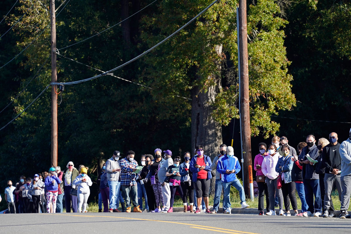 Early voters form a line along South Alston Ave. to cast their ballots at the South Regional Library polling location in Durham, North Carolina, on October 15.