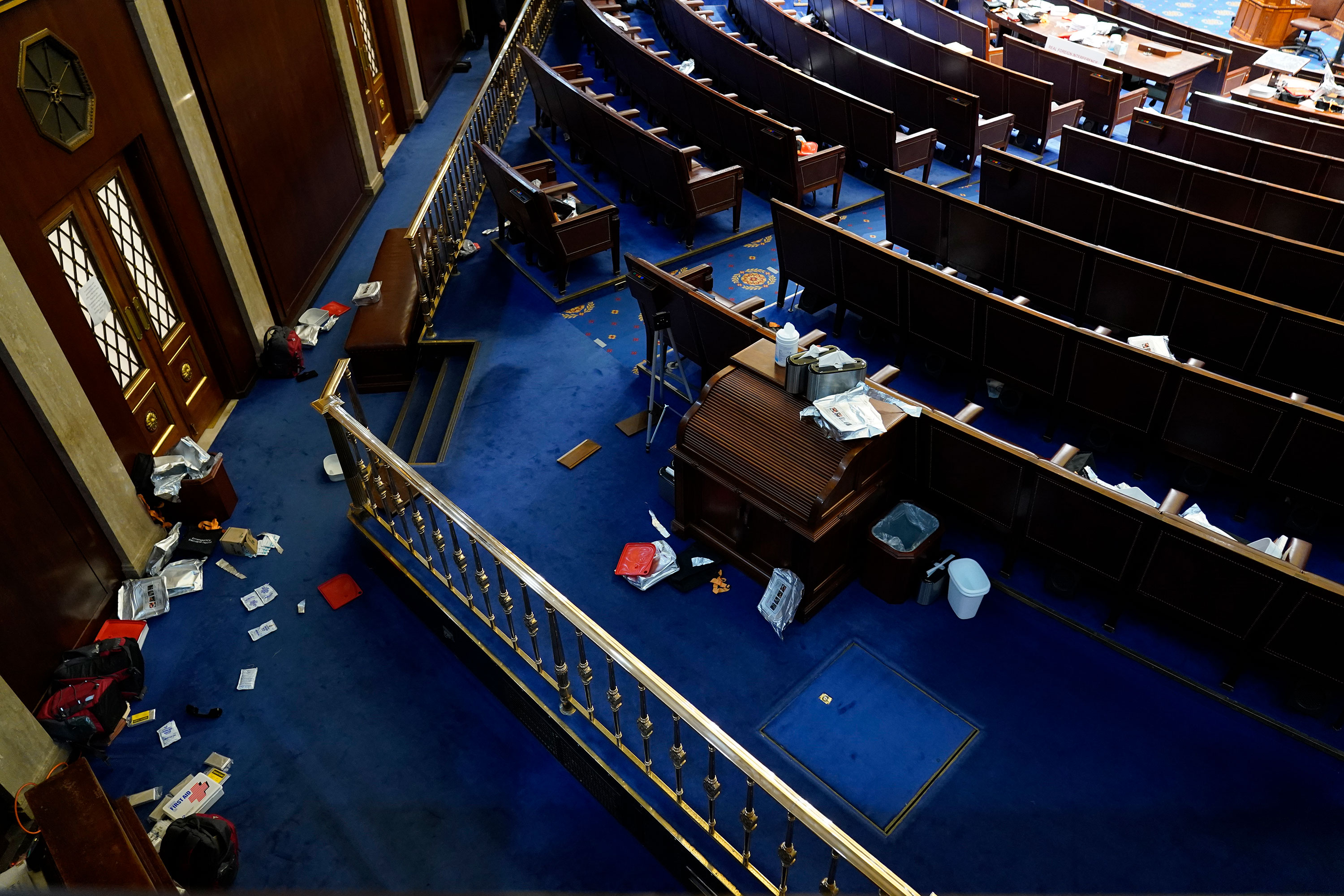 Papers and other materials litter the chamber after House were evacuated as protesters try to break into the House Chamber at the U.S. Capitol on Wednesday, January 6, in Washington. 