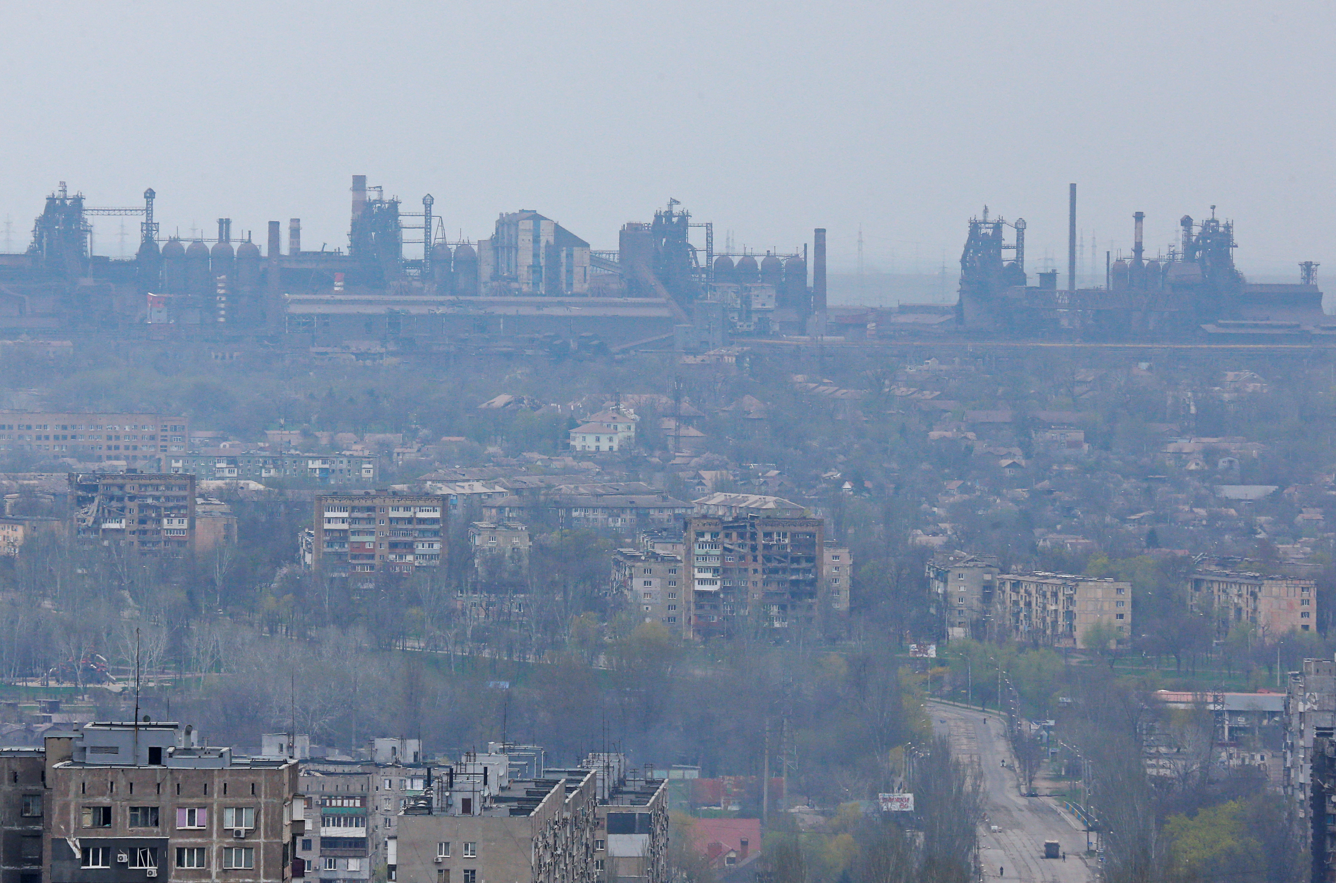 The Azovstal Iron and Steel Works dominates the skyline above ruined apartment buildings in the southern port city of Mariupol, Ukraine, on April 19.